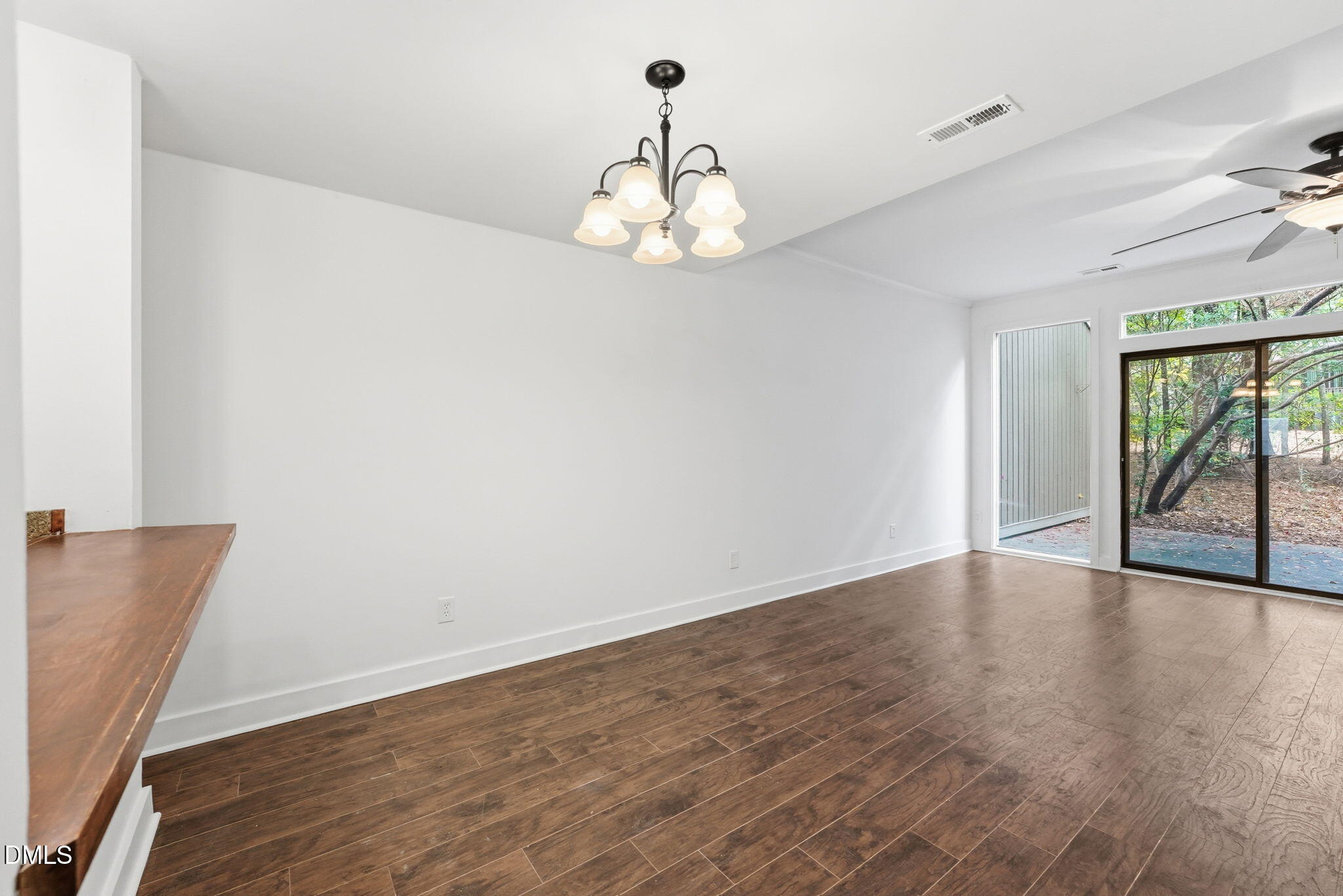1 Vauxhall Place Chapel Hill, NC 27517 - Photo 13 of 25 a view of an empty room with wooden floor and a window