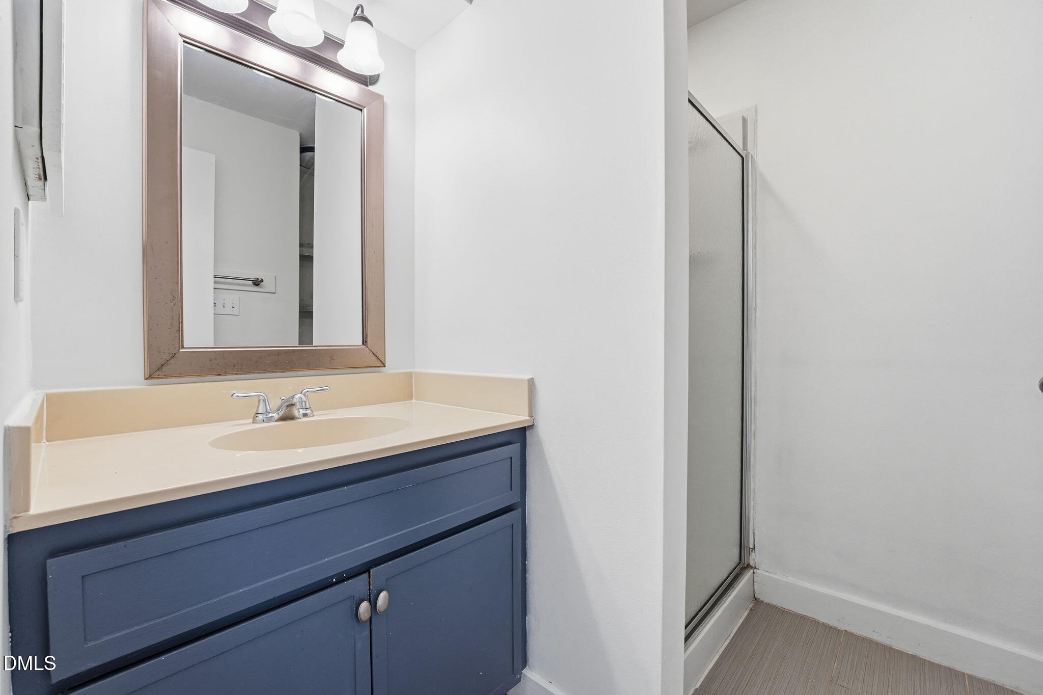 1 Vauxhall Place Chapel Hill, NC 27517 - Photo 17 of 25 a bathroom with a sink and a mirror