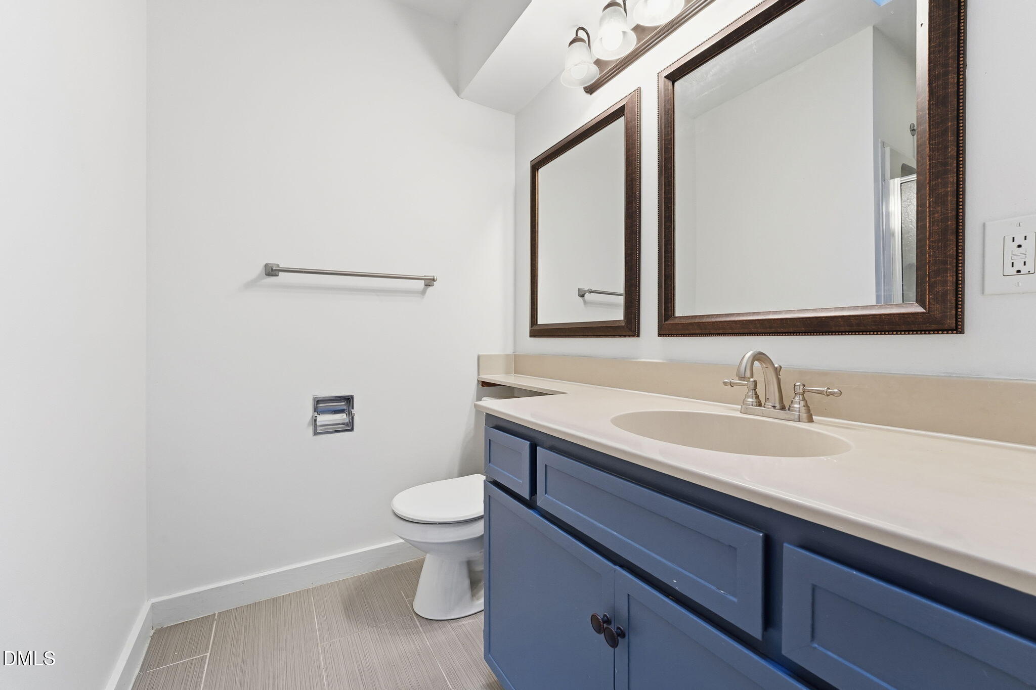 1 Vauxhall Place Chapel Hill, NC 27517 - Photo 20 of 25 a bathroom with a granite countertop toilet sink and mirror