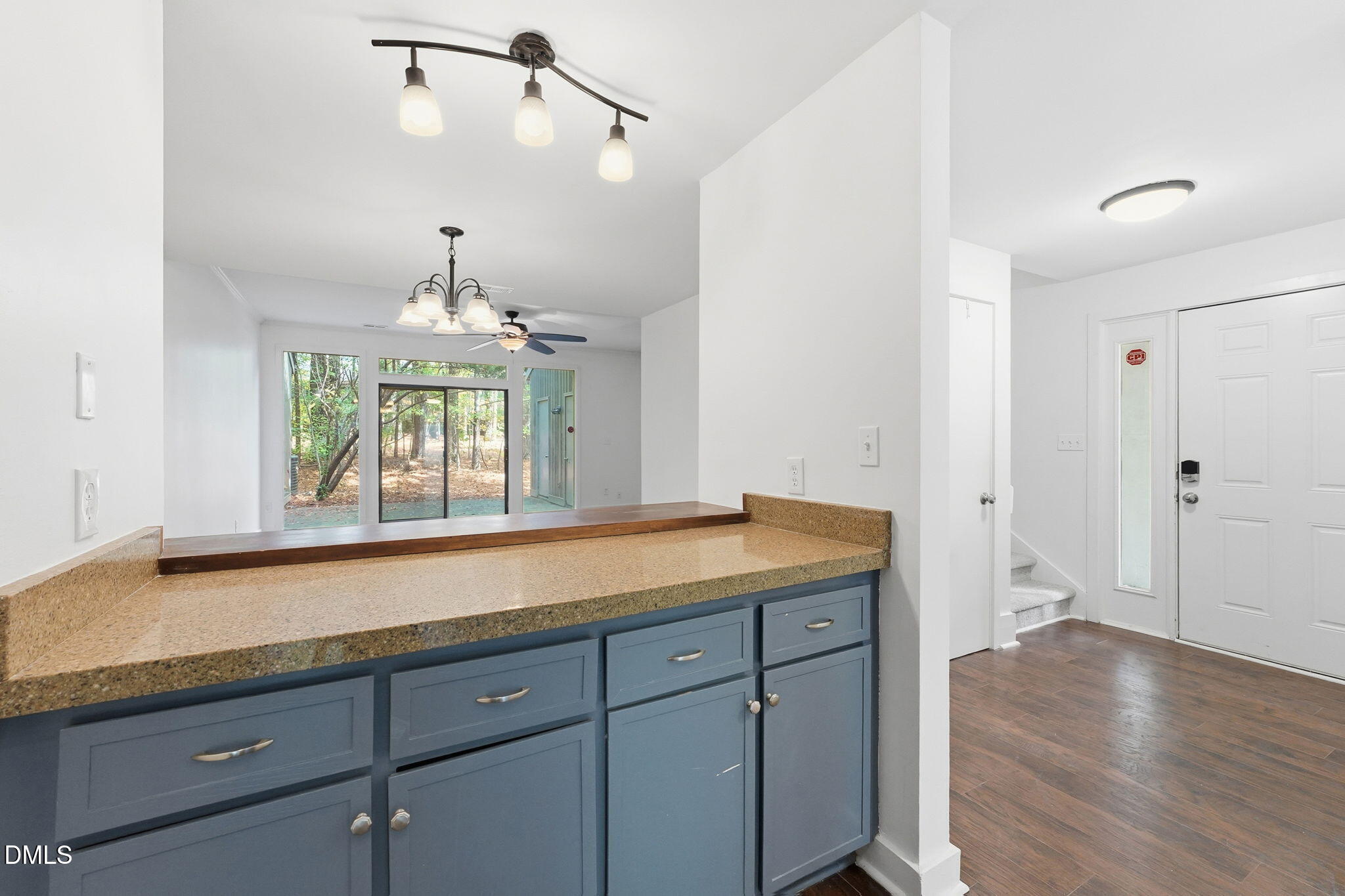 1 Vauxhall Place Chapel Hill, NC 27517 - Photo 5 of 25 a view of a kitchen with granite countertop white cabinets and a chandelier