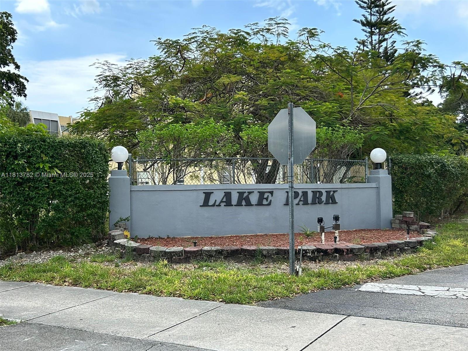 922 Northeast 199th Street, Unit 3D 304 Miami, FL 33179 - Photo 2 of 7 a sign that is sitting on the side of a road