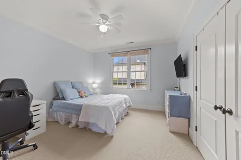 a bedroom with a bed and cabinets
