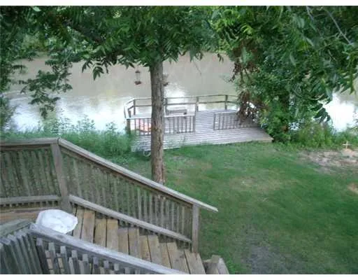 a view of a deck with a backyard