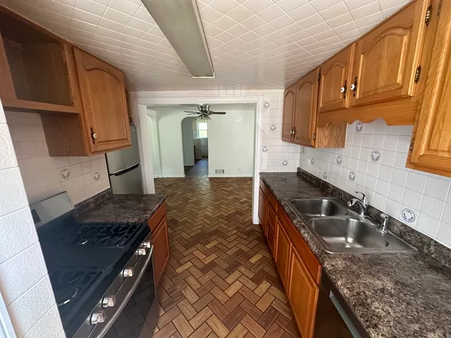 a kitchen that has a sink and a stove