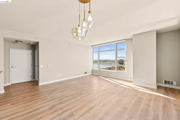 a stove top oven sitting inside of a kitchen