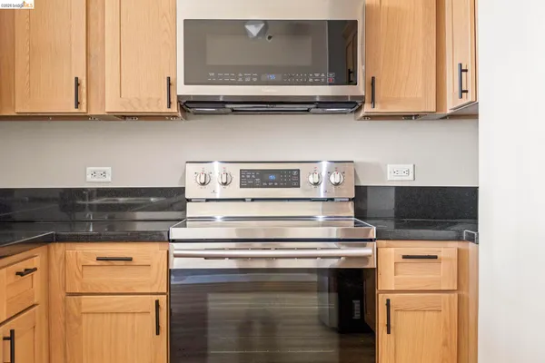 a kitchen with stainless steel appliances granite countertop a stove and a sink