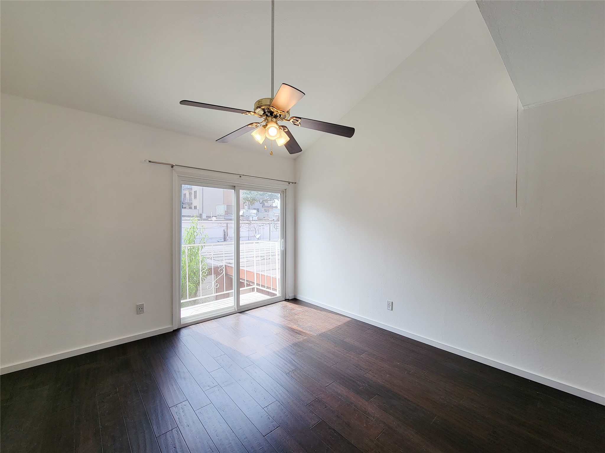 2243 West Alabama Street, Unit B Houston, TX 77098 - Photo 39 of 44 an empty room with wooden floor fan and windows