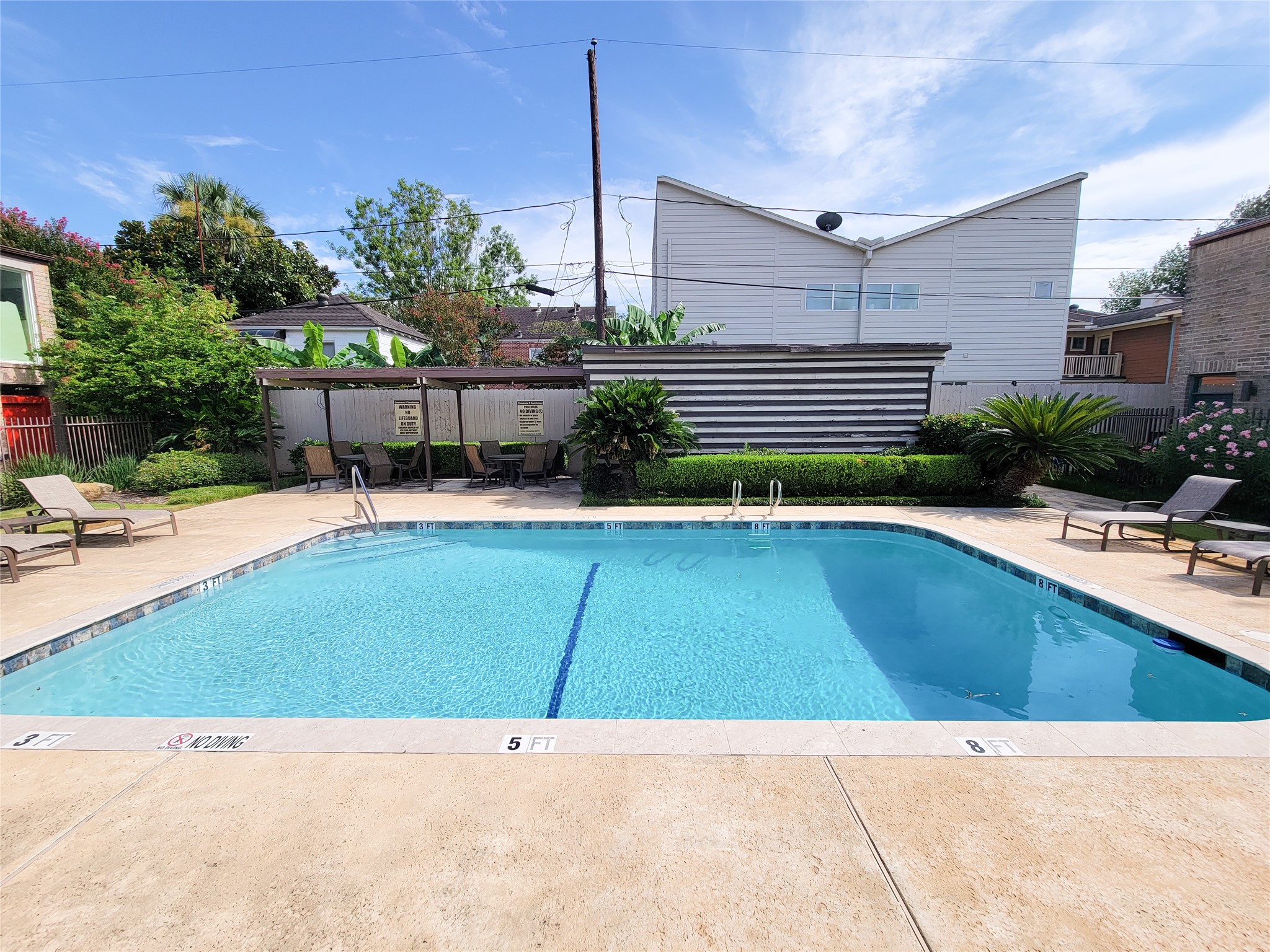2243 West Alabama Street, Unit B Houston, TX 77098 - Photo 41 of 44 a view of a swimming pool with a patio