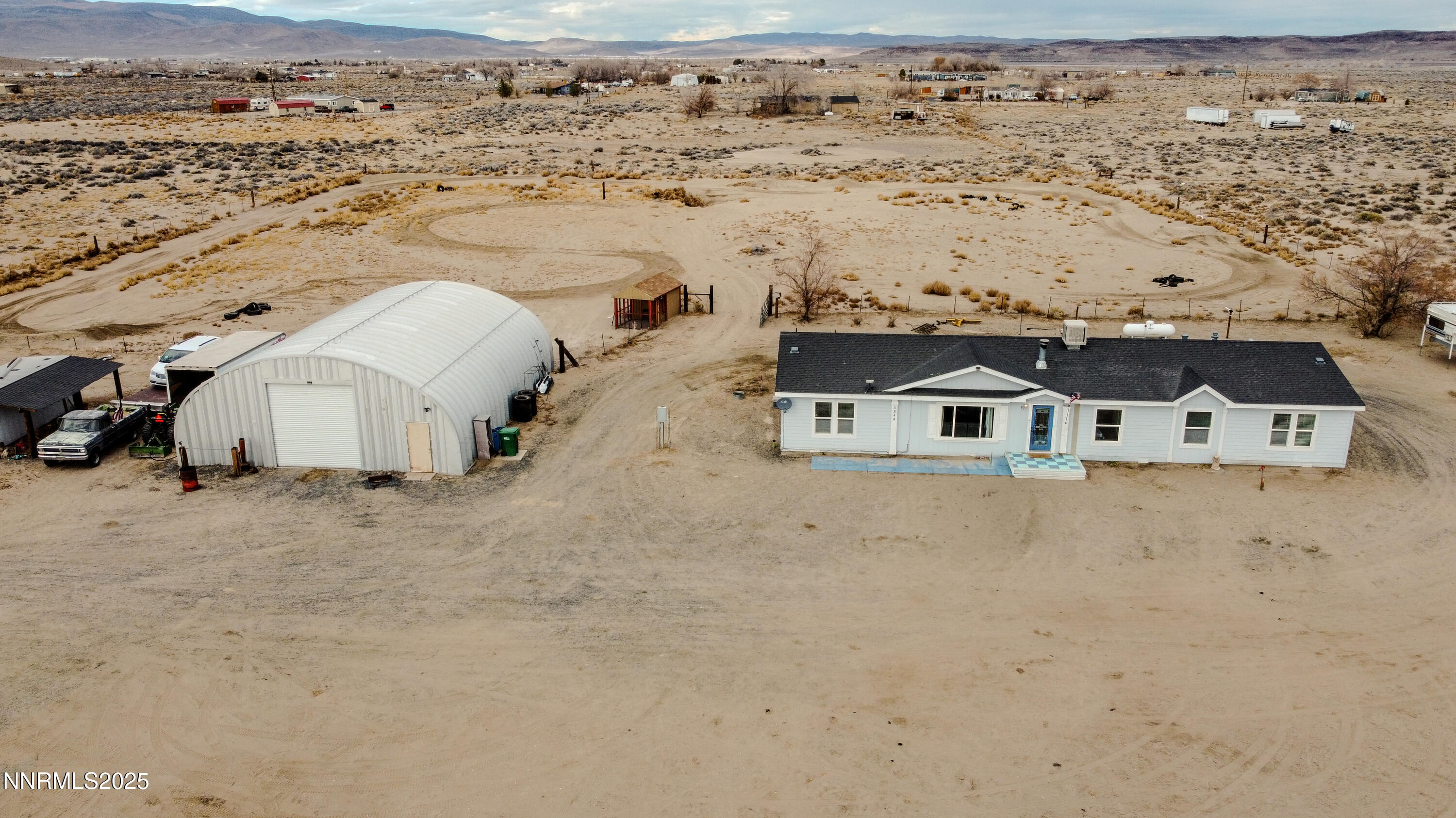 3250 4th Street Silver Springs, NV 89429 - Photo 15 of 73 an aerial view of residential houses with outdoor space