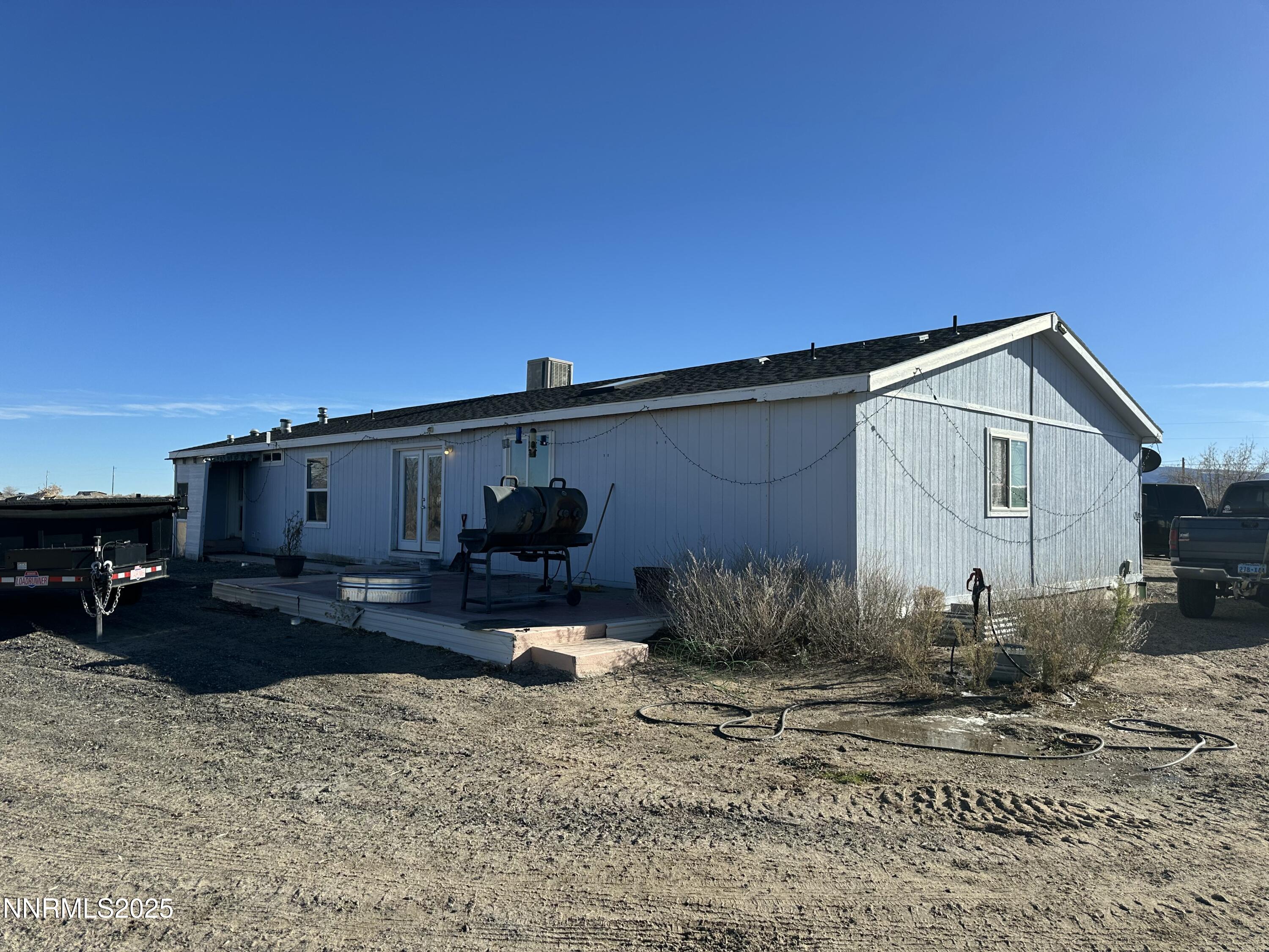 3250 4th Street Silver Springs, NV 89429 - Photo 2 of 73 a view of a back yard of the house