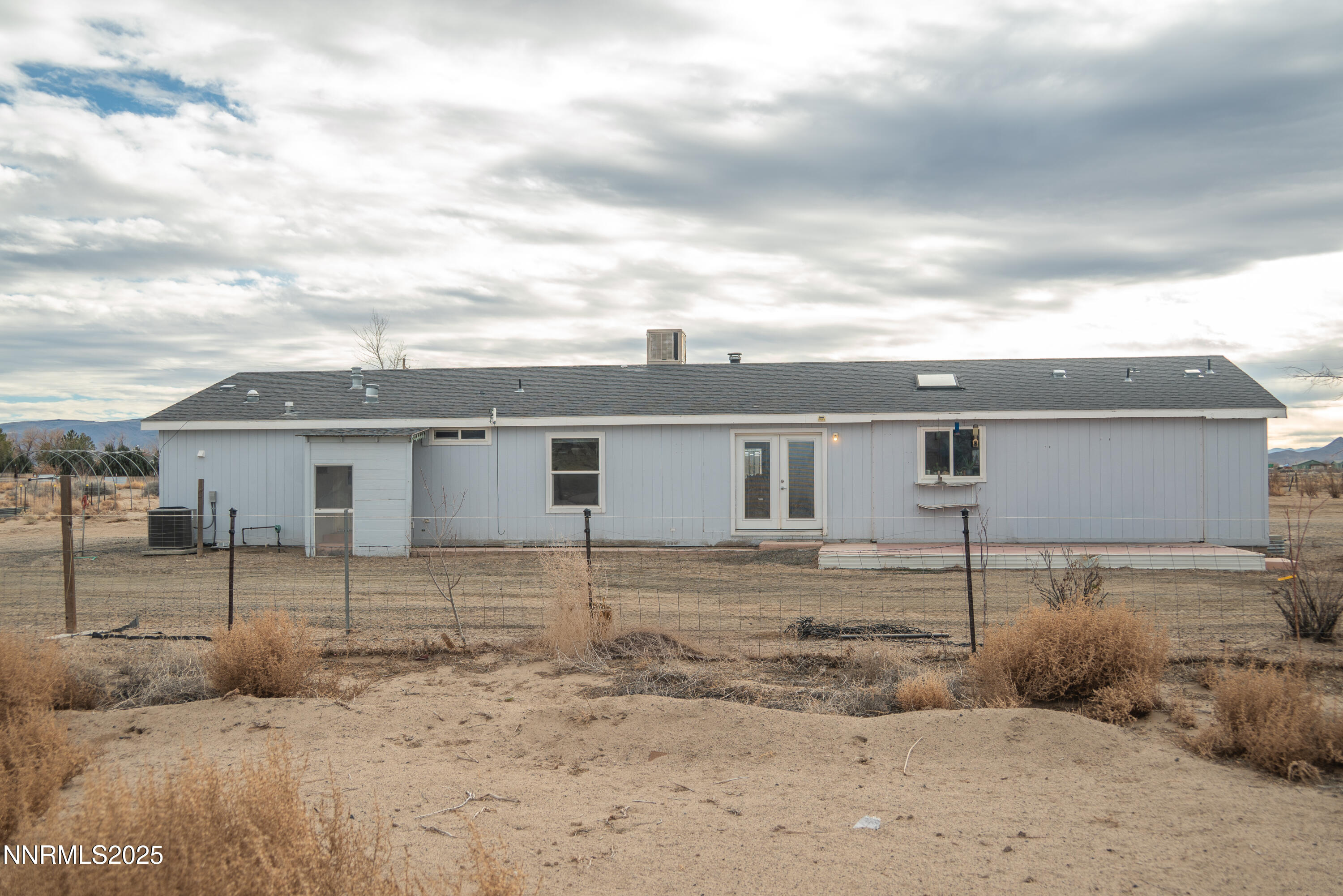 3250 4th Street Silver Springs, NV 89429 - Photo 22 of 73 a view of a house with a backyard
