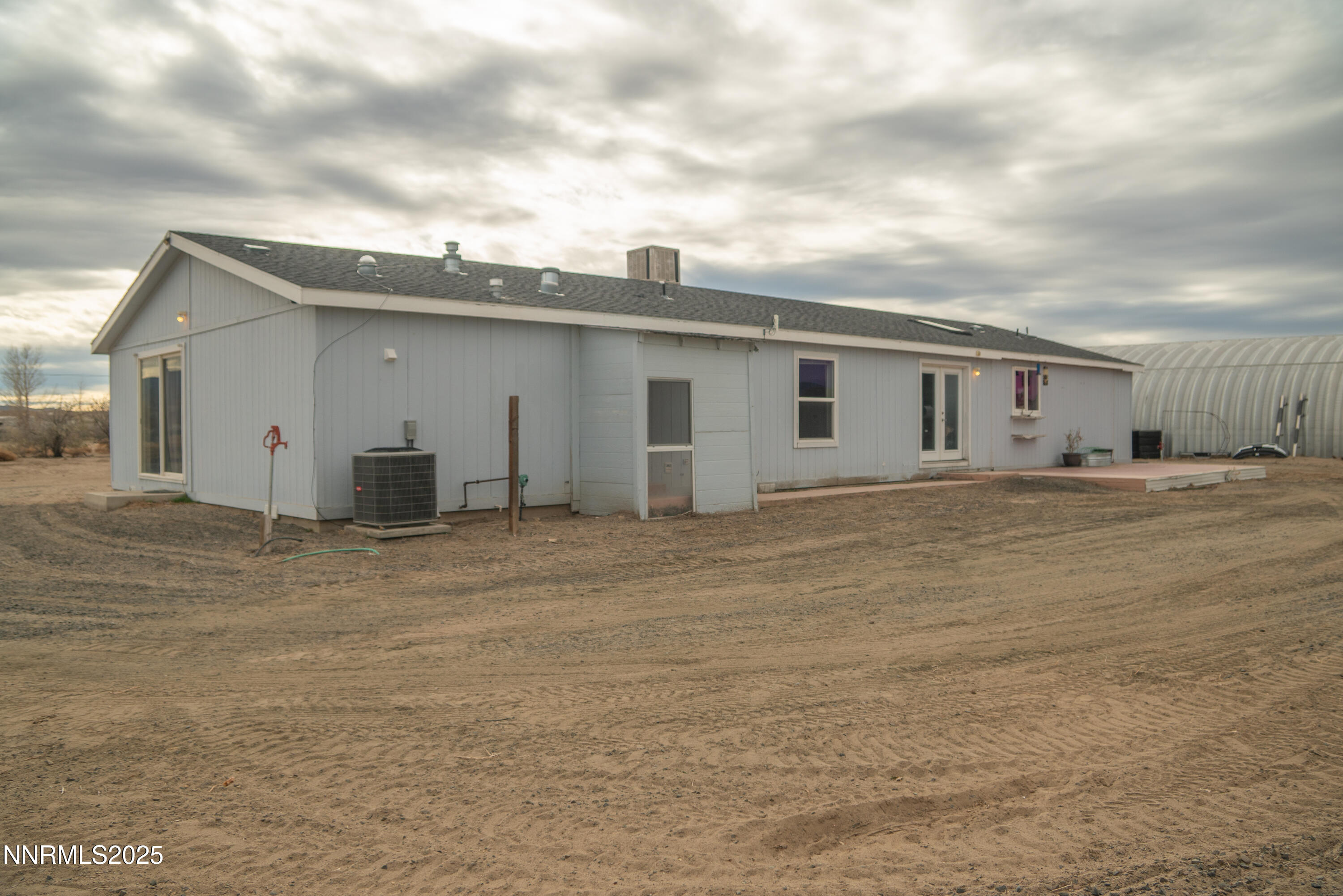 3250 4th Street Silver Springs, NV 89429 - Photo 24 of 73 a view of a house with a backyard