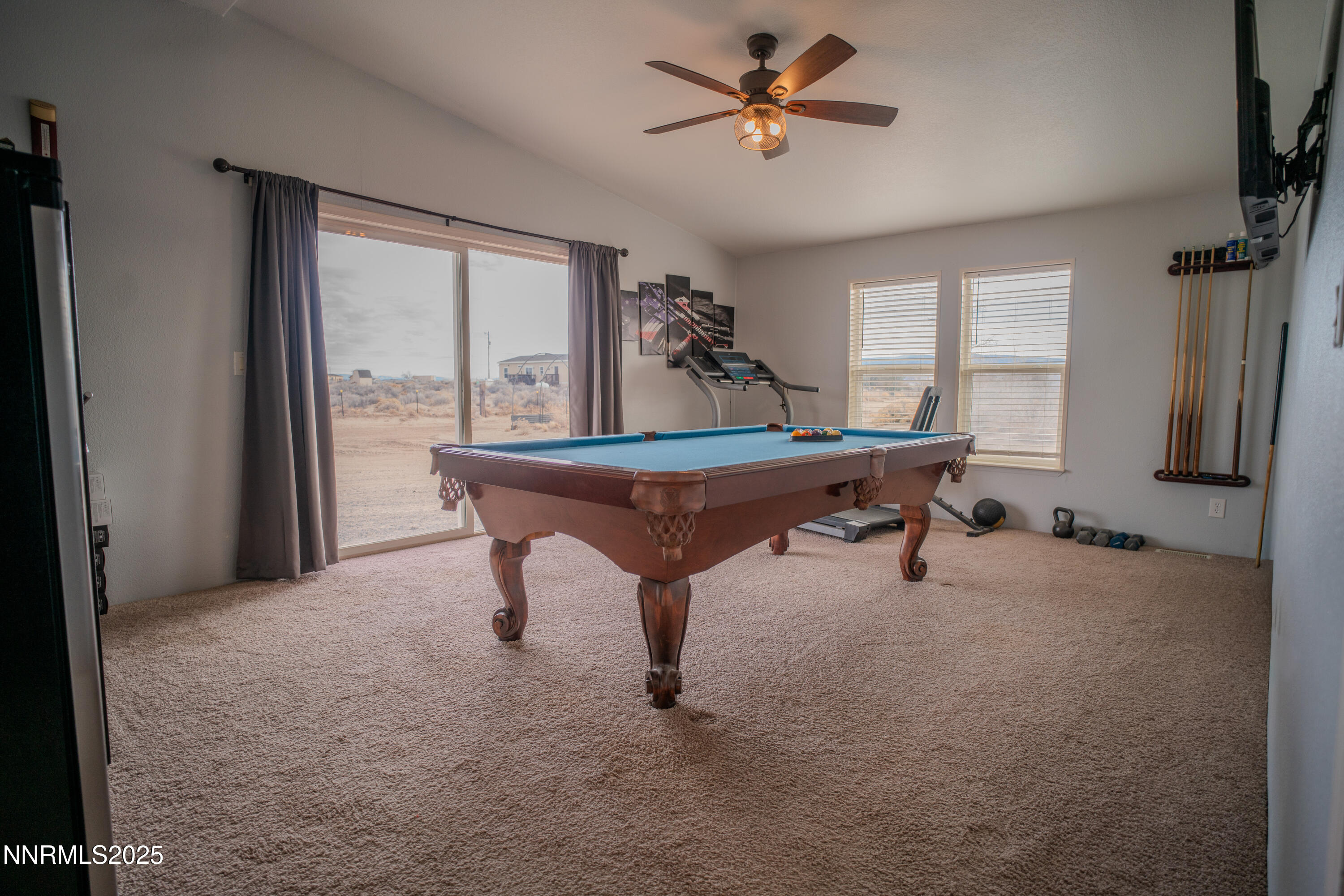 3250 4th Street Silver Springs, NV 89429 - Photo 30 of 73 a room with a table chairs and windows