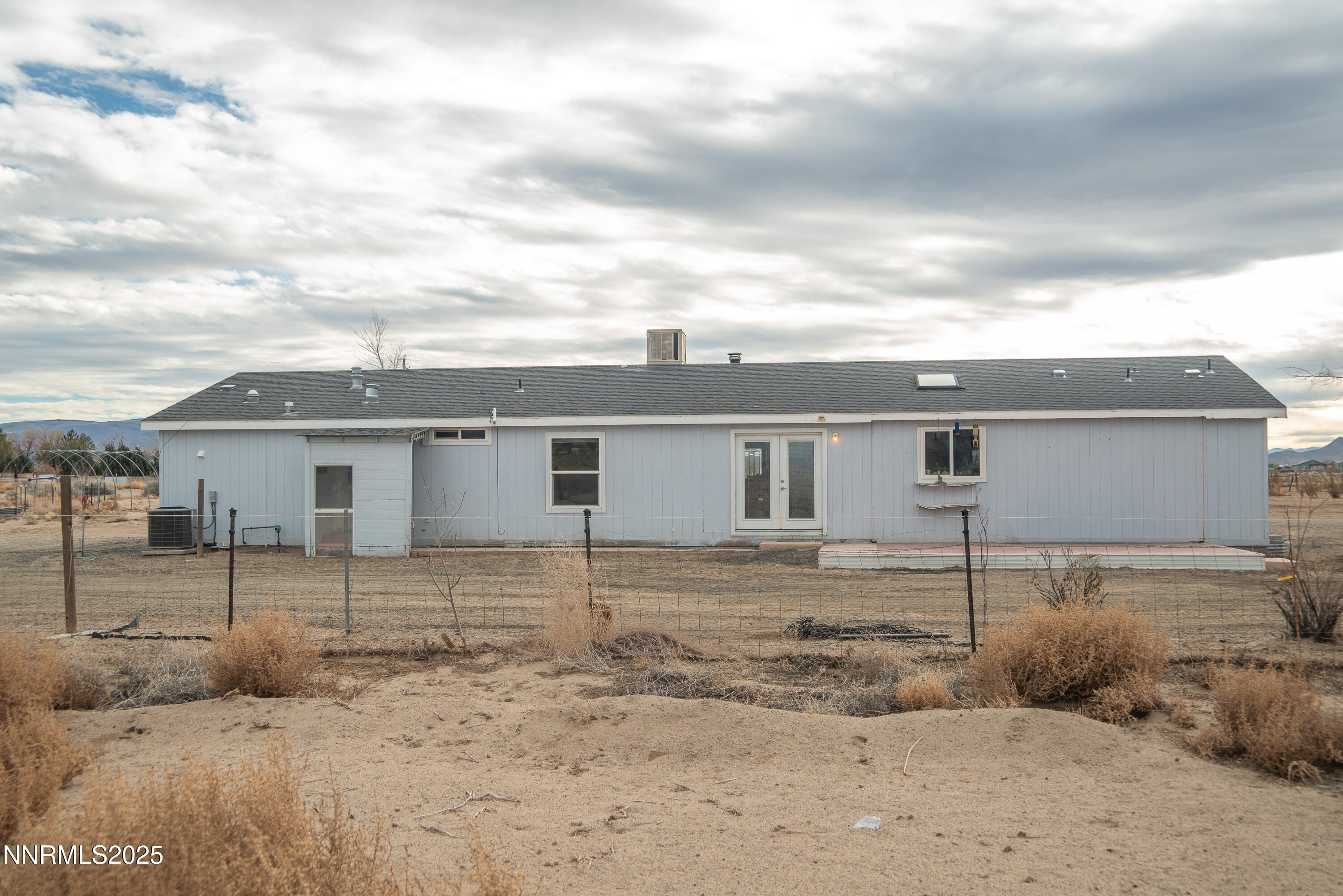 3250 4th Street Silver Springs, NV 89429 - Photo 55 of 73 a view of a house with a backyard