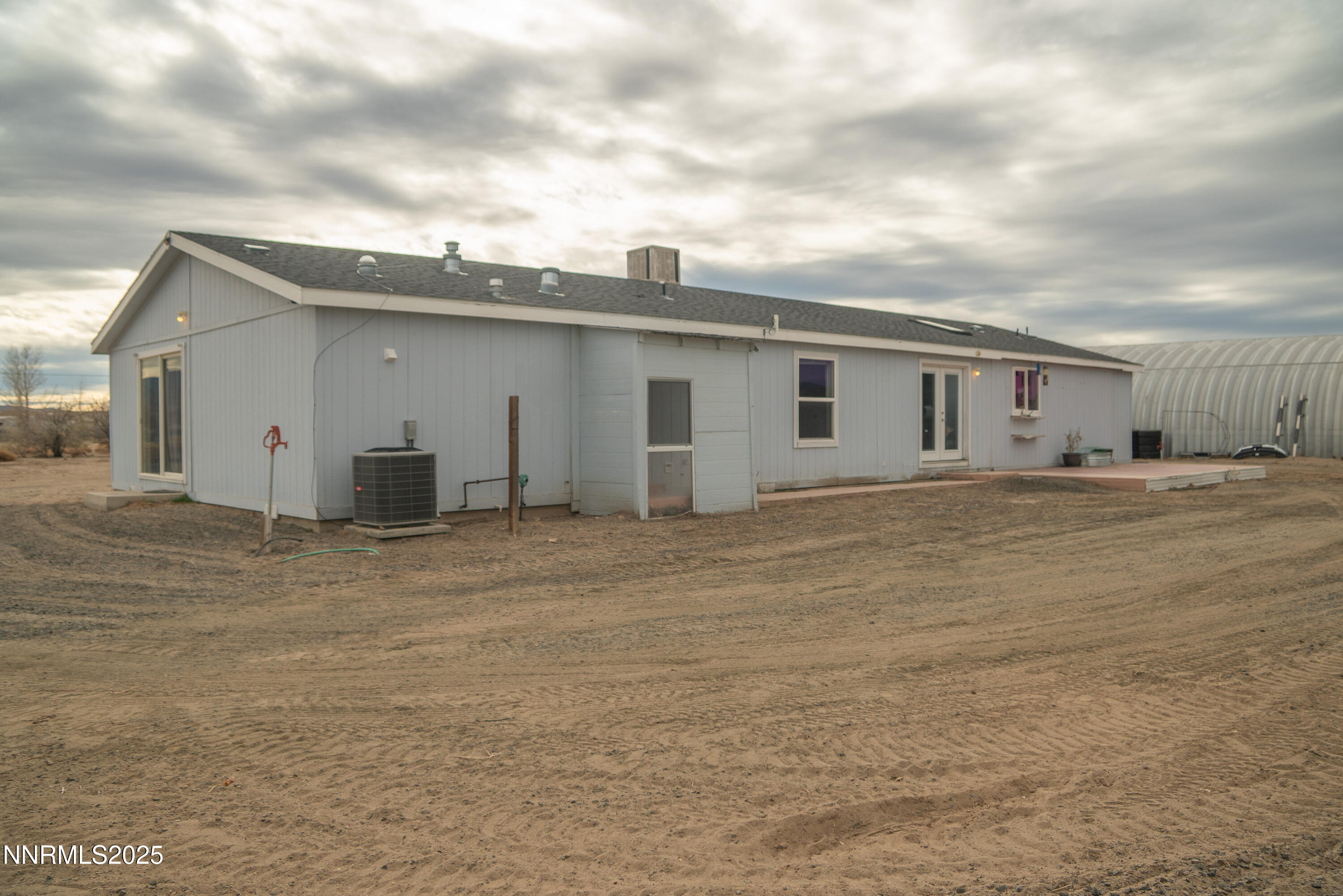 3250 4th Street Silver Springs, NV 89429 - Photo 57 of 73 a view of a house with a backyard