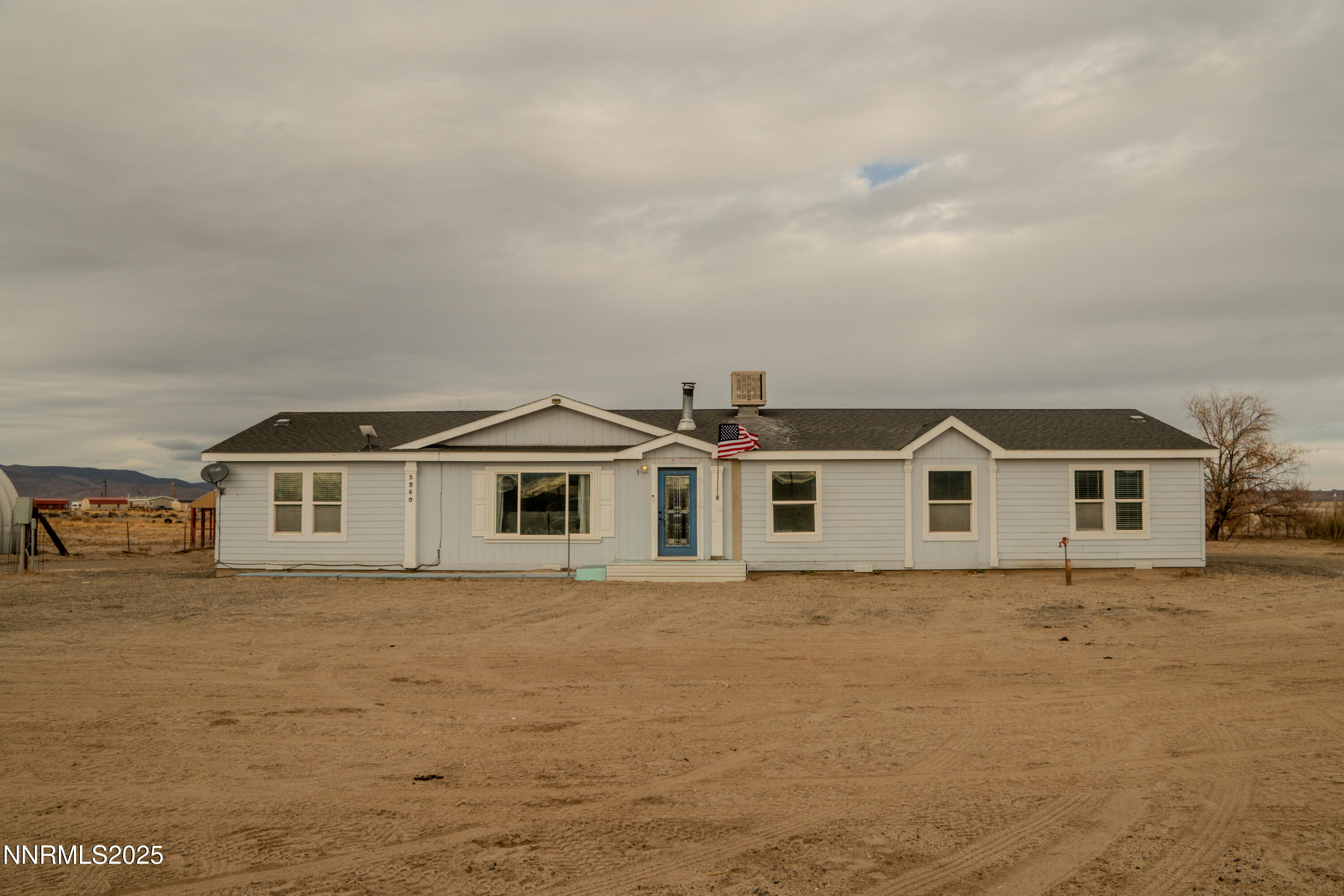 3250 4th Street Silver Springs, NV 89429 - Photo 59 of 73 front view of a house with a yard