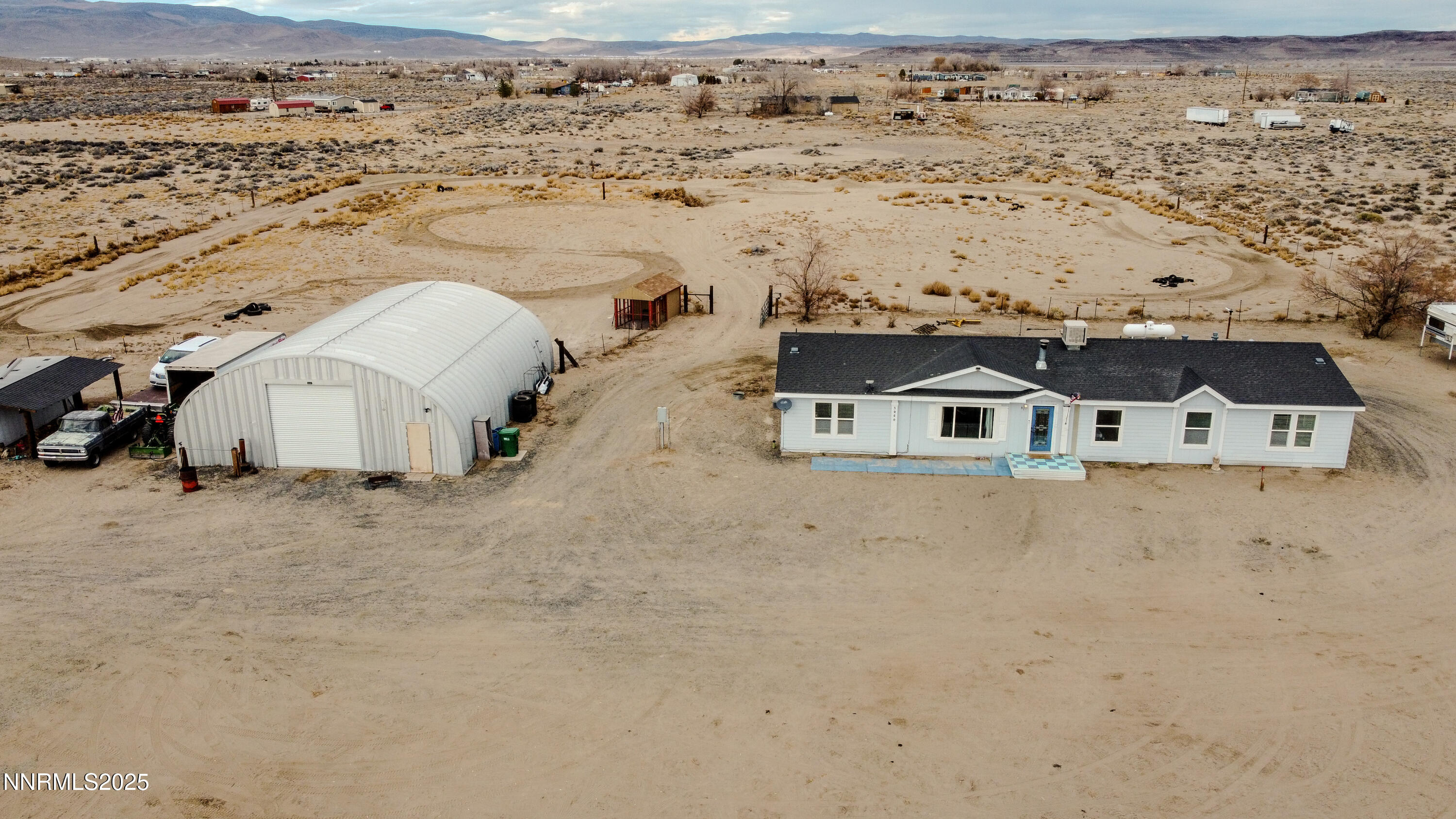 3250 4th Street Silver Springs, NV 89429 - Photo 69 of 73 an aerial view of residential houses with outdoor space