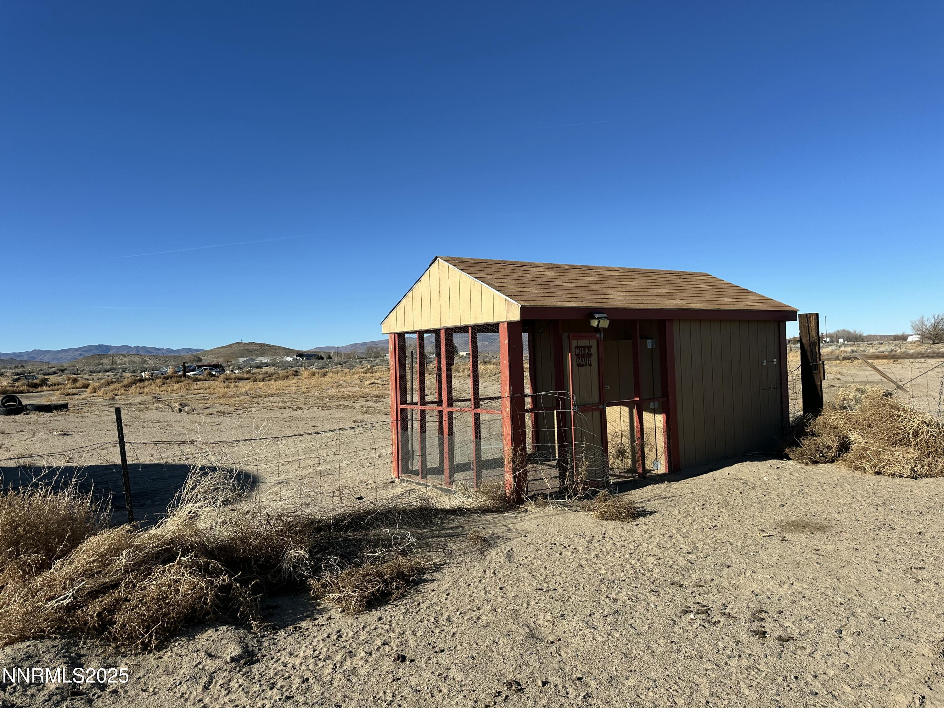 3250 4th Street Silver Springs, NV 89429 - Photo 7 of 73 a front view of a house with a yard