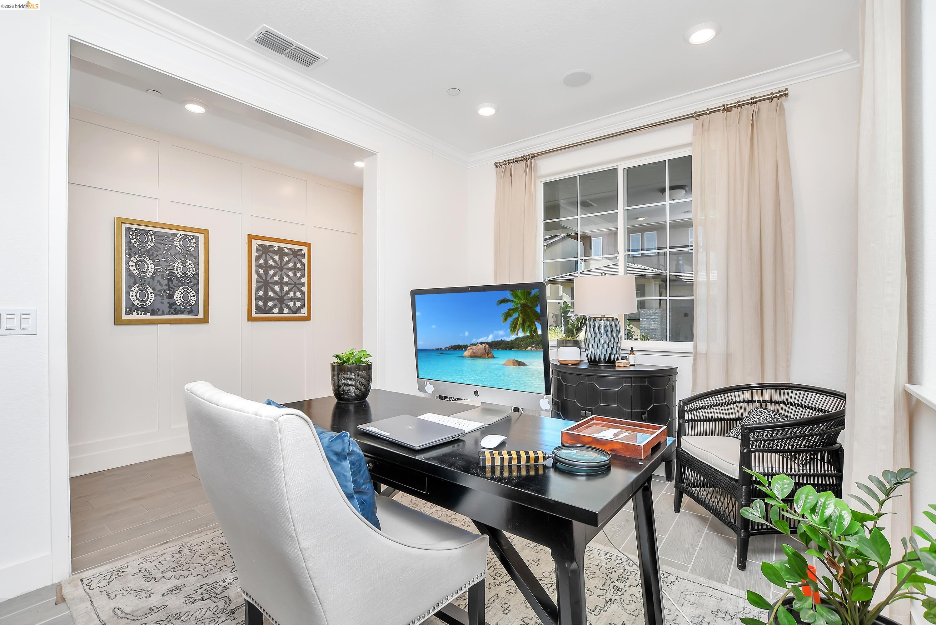 829 Hardcastle Ranch Road Oakley, CA 94561 - Photo 8 of 41 Recessed lighting illuminates the room, featuring a window with grid patterns and light-colored drapes