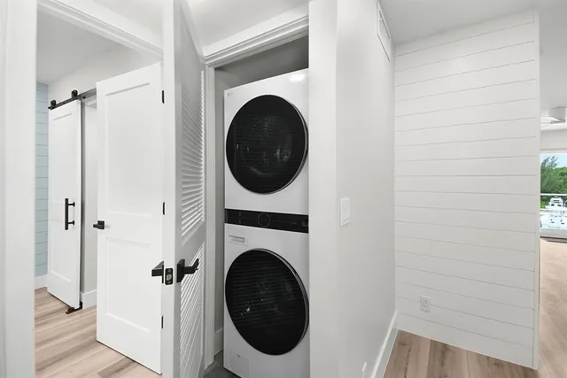 a view of a hallway with washer and dryer
