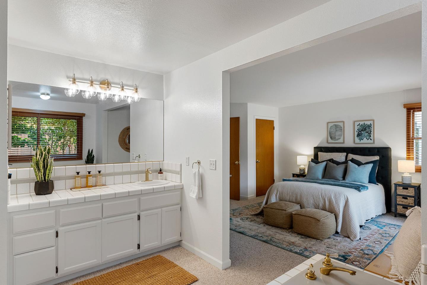 1817 Via Pacifica Aptos, CA 95003 - Photo 16 of 40 a en suite bathroom with a double vanity sink and a mirror