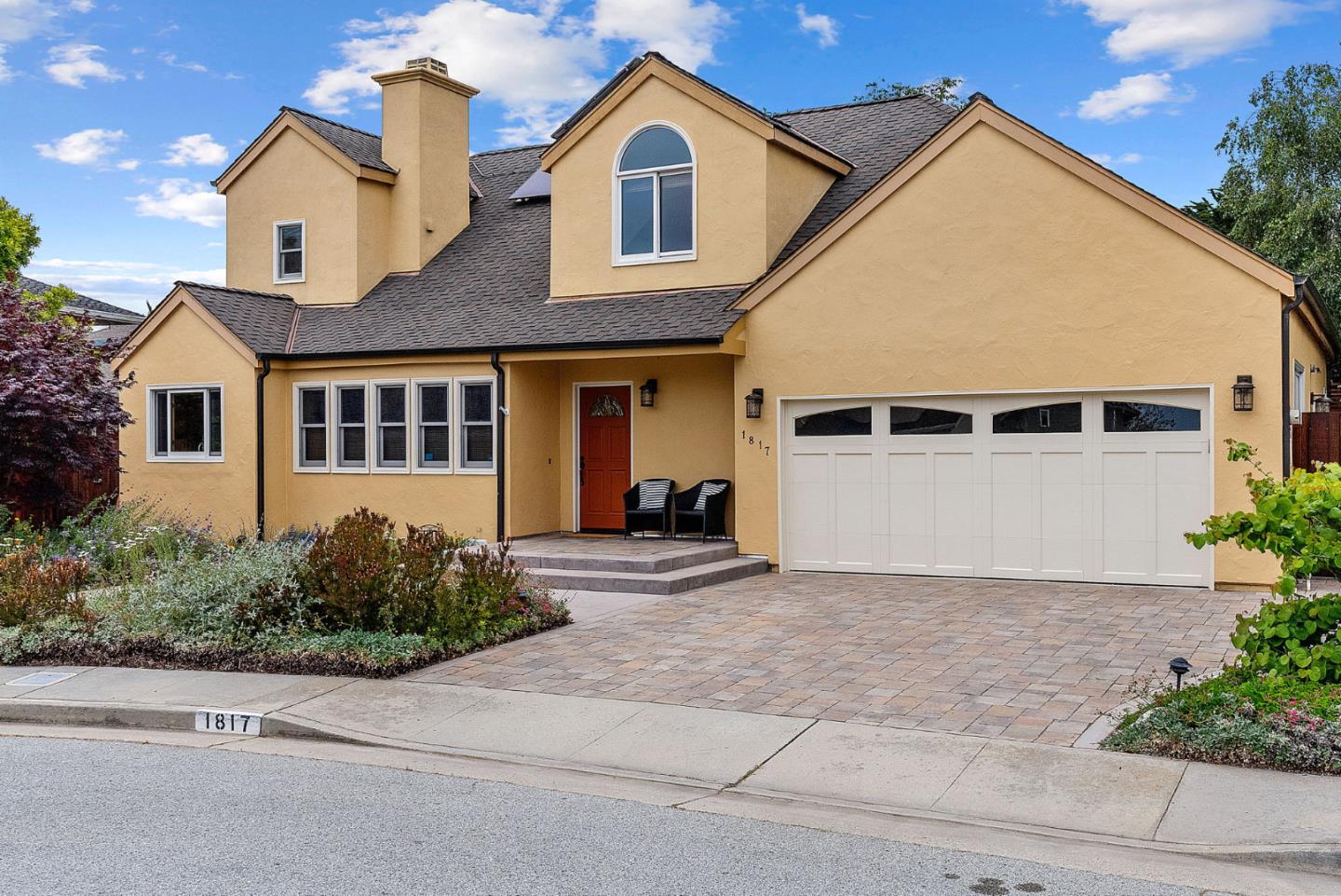 1817 Via Pacifica Aptos, CA 95003 - Photo 3 of 40 a view of a white house with a yard and plants