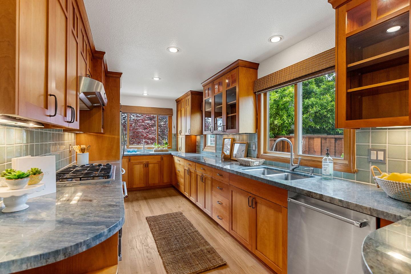 1817 Via Pacifica Aptos, CA 95003 - Photo 10 of 40 a kitchen with stainless steel appliances granite countertop a sink and a counter space
