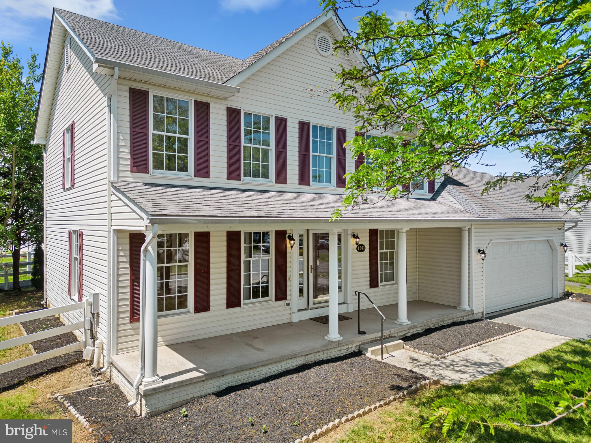 a front view of a house with a porch