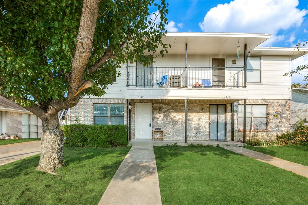 3309 Fallmeadow Street Denton, TX 76207 - Photo 2 of 12 a front view of a house with a garden and plants