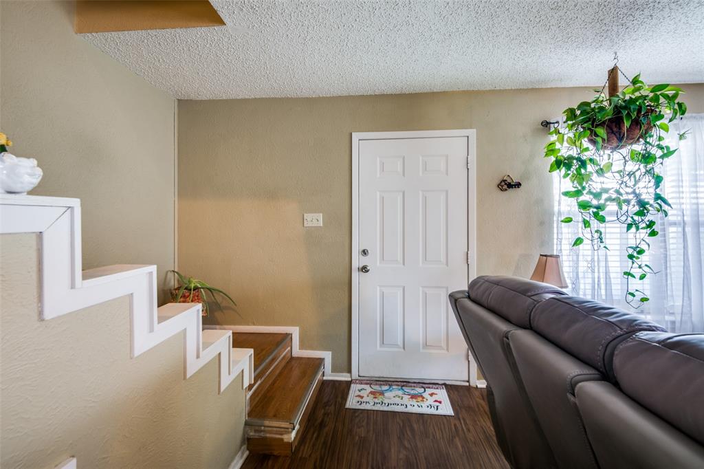 3309 Fallmeadow Street Denton, TX 76207 - Photo 4 of 12 a living room with furniture and a potted plant