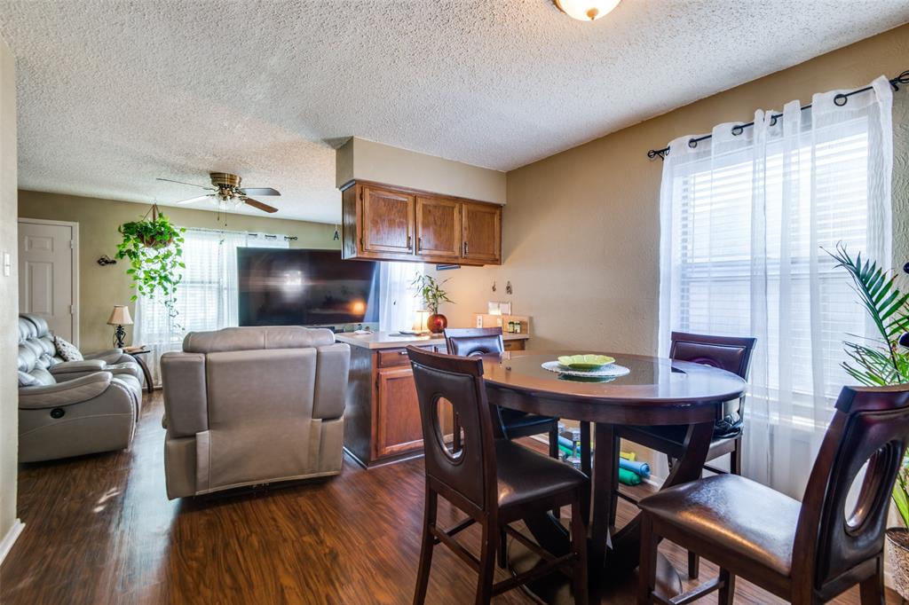 3309 Fallmeadow Street Denton, TX 76207 - Photo 6 of 12 a view of a dining room with furniture window and wooden floor