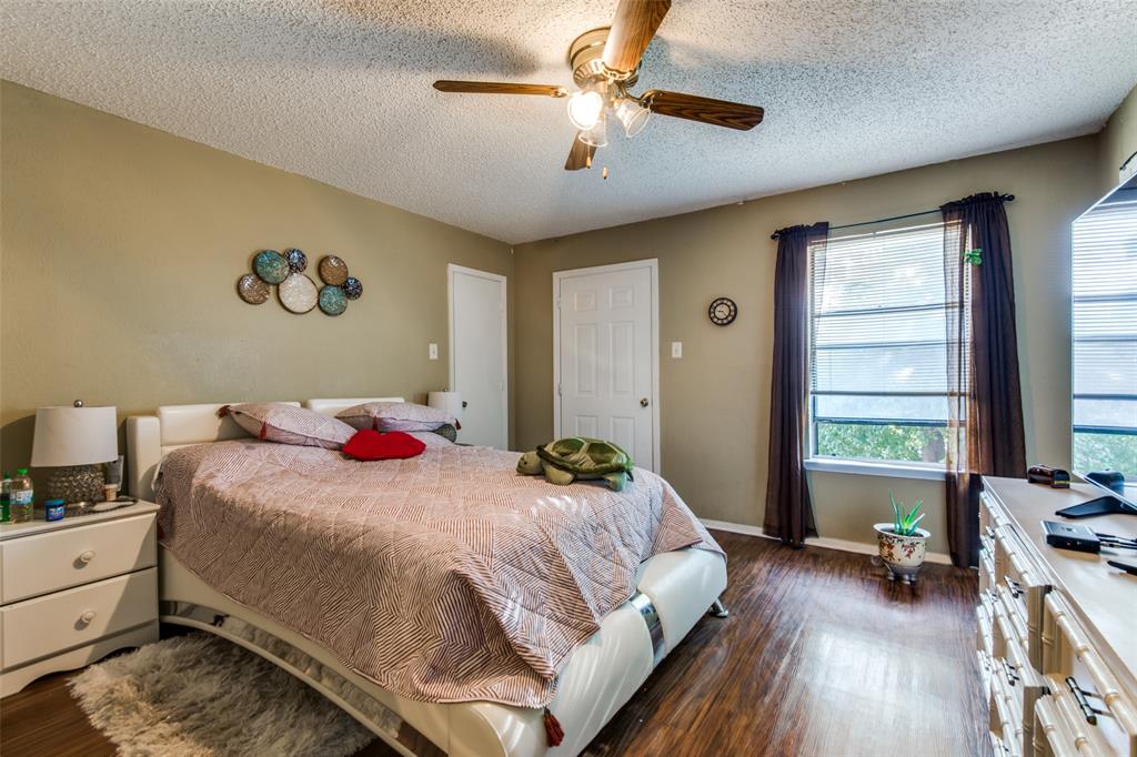 3309 Fallmeadow Street Denton, TX 76207 - Photo 9 of 12 a bedroom with a bed and a dresser next to a window