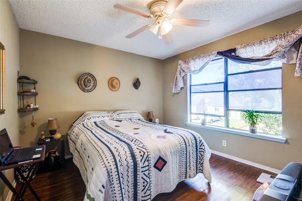 3309 Fallmeadow Street Denton, TX 76207 - Photo 10 of 12 a bedroom with a bed and a window