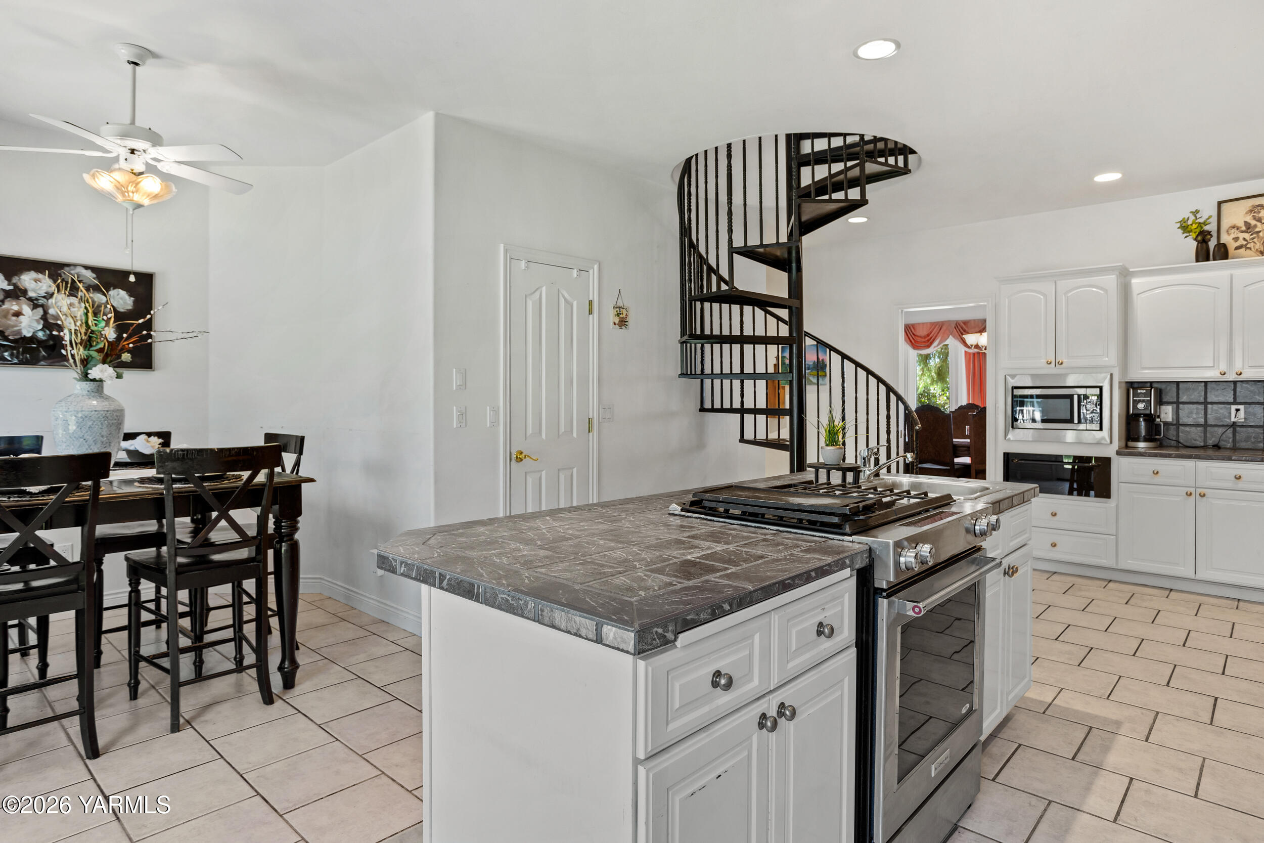 14801 Summitview Ext Road Yakima, WA 98908 - Photo 13 of 80 a kitchen island with a table and chairs in it
