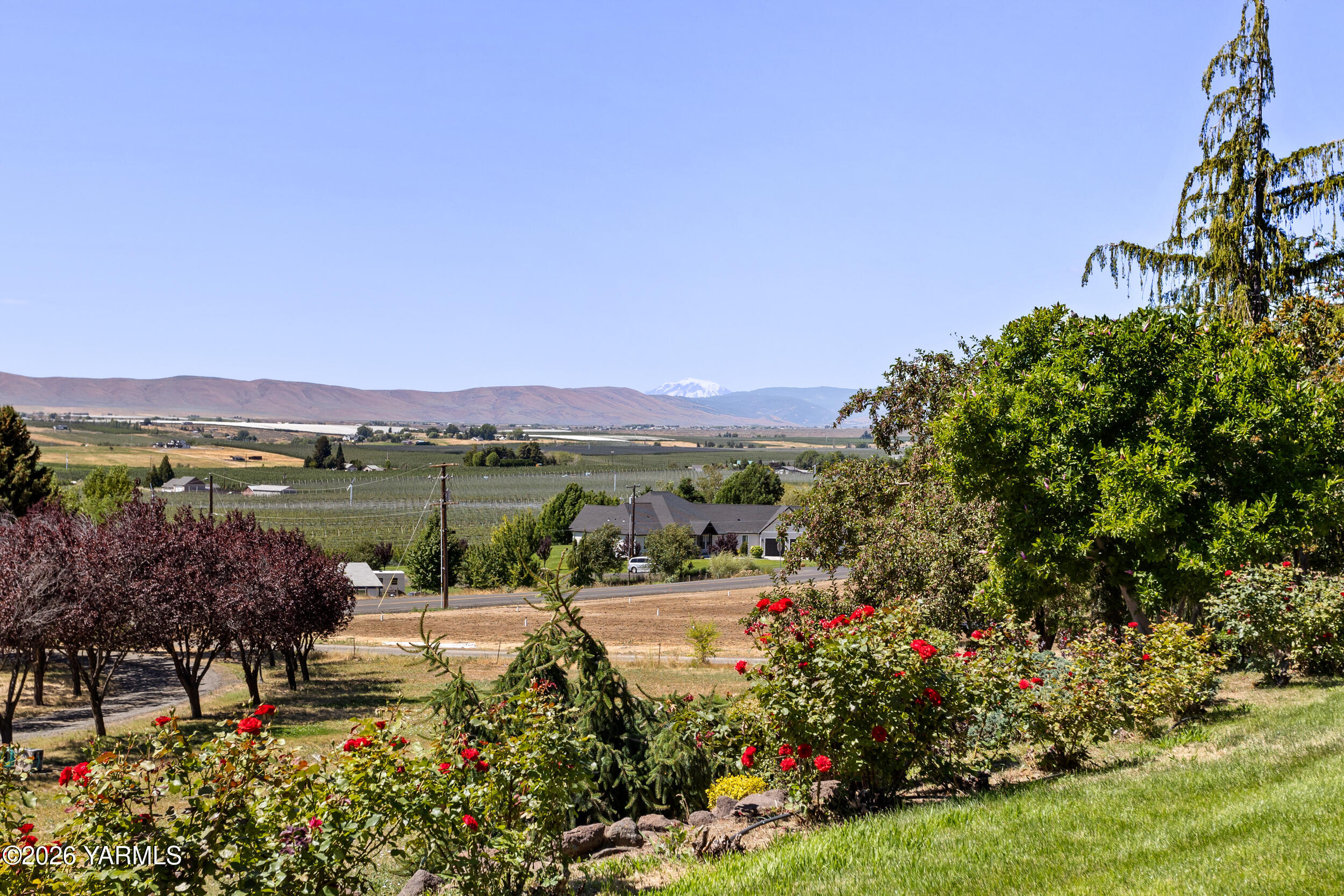 14801 Summitview Ext Road Yakima, WA 98908 - Photo 54 of 80 a view of a lake with a house in the background