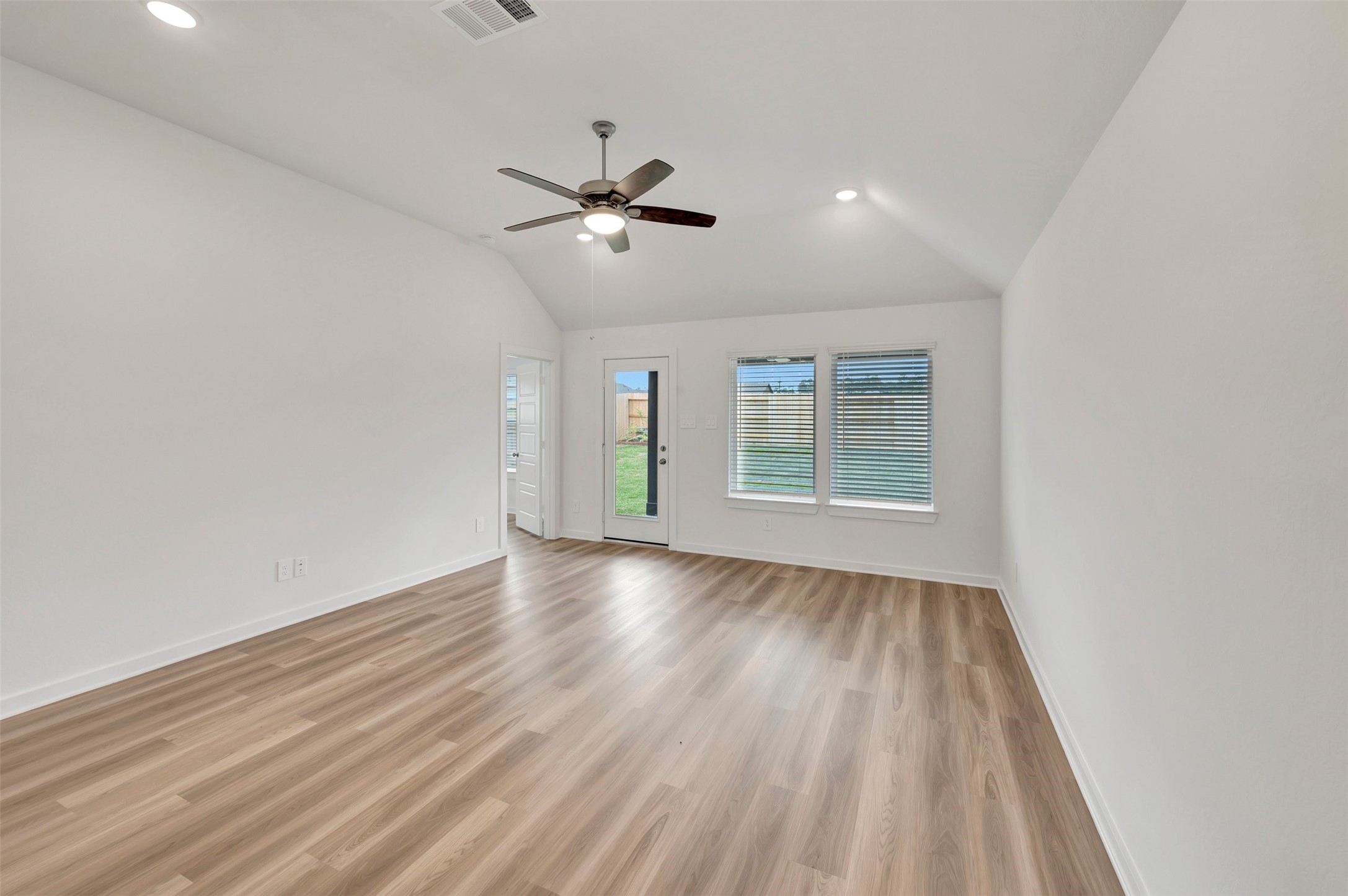 543 Flower Reed Court Magnolia, TX 77354 - Photo 23 of 46 a view of empty room with wooden floor and fan
