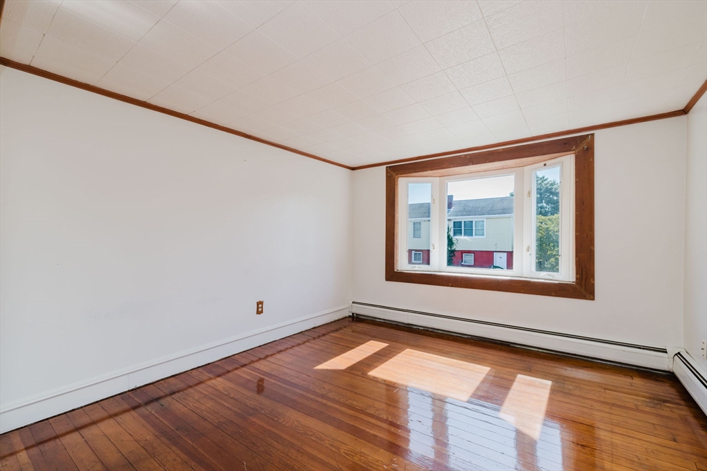 1957 Rodman Street Fall River, MA 02721 - Photo 18 of 32 a view of a room with wooden floor and window