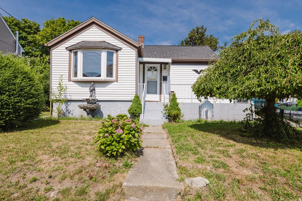 1957 Rodman Street Fall River, MA 02721 - Photo 3 of 32 a front view of a house with garden