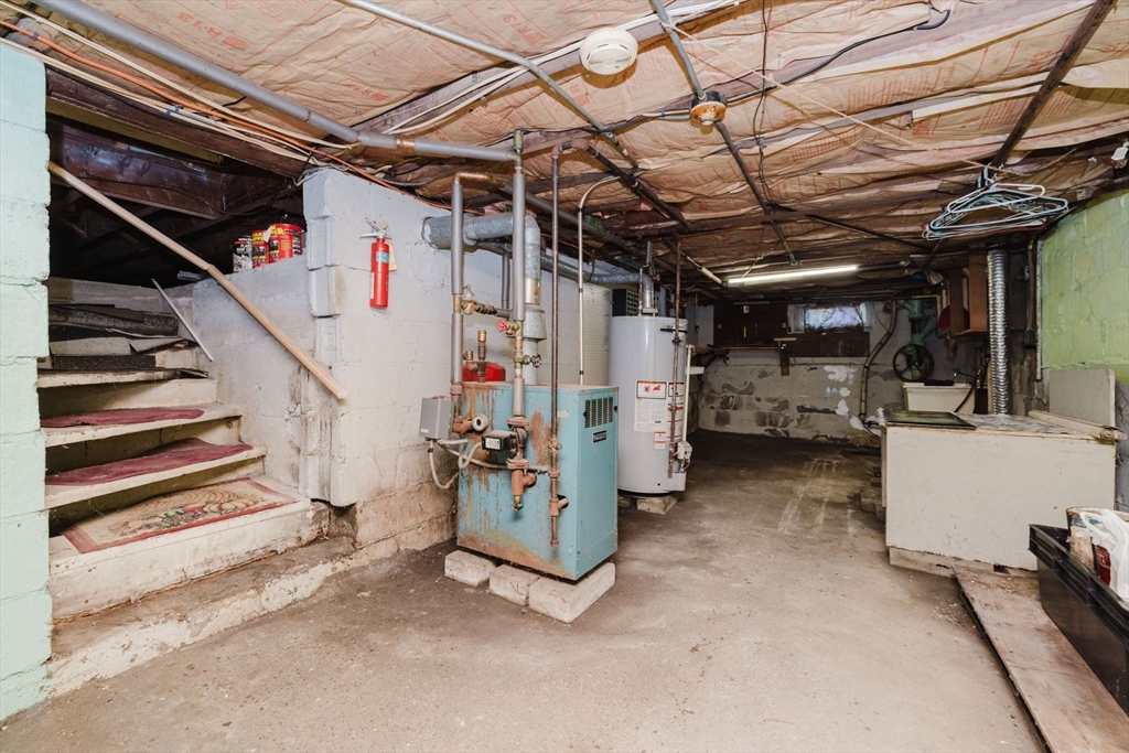 1957 Rodman Street Fall River, MA 02721 - Photo 32 of 32 a view of storage and utility room with stairs