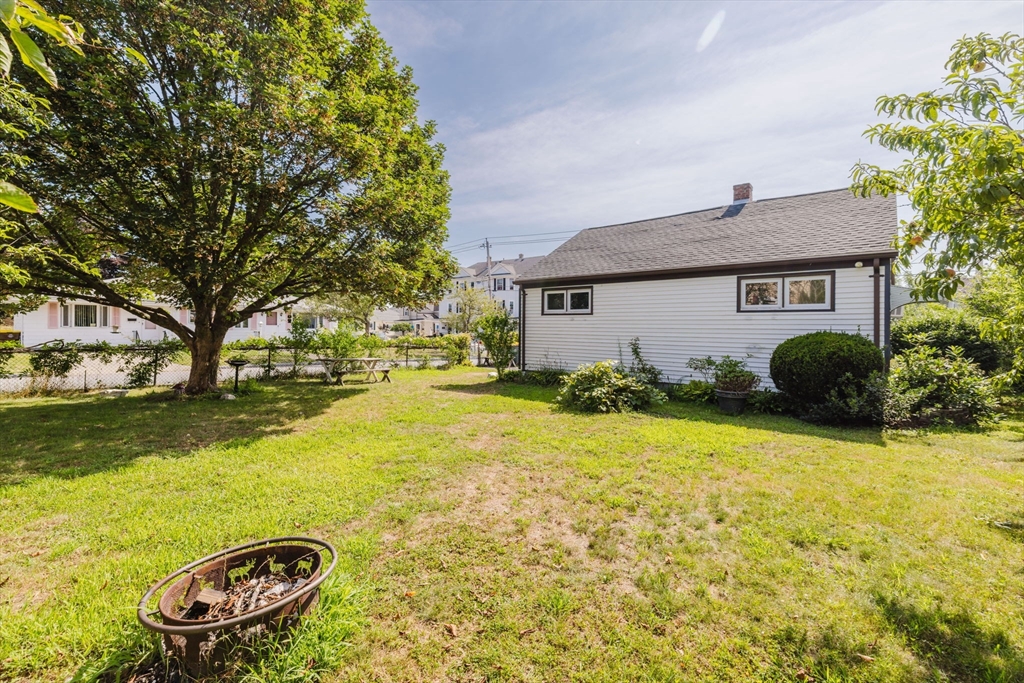 1957 Rodman Street Fall River, MA 02721 - Photo 6 of 32 a front view of a house with a yard