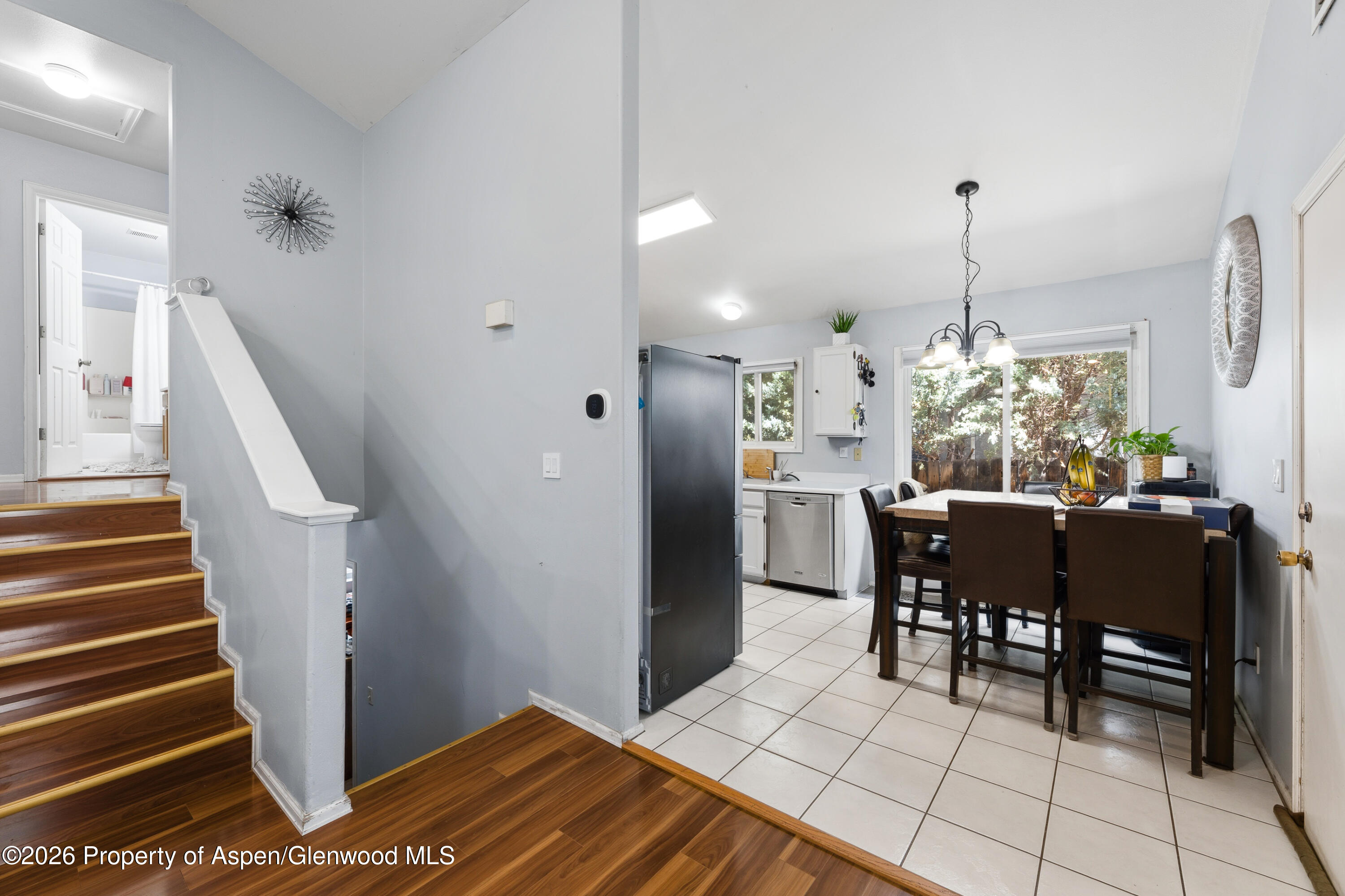 164 Current Drive New Castle, CO 81647 - Photo 11 of 34 a dining room filled with furniture and wooden floor