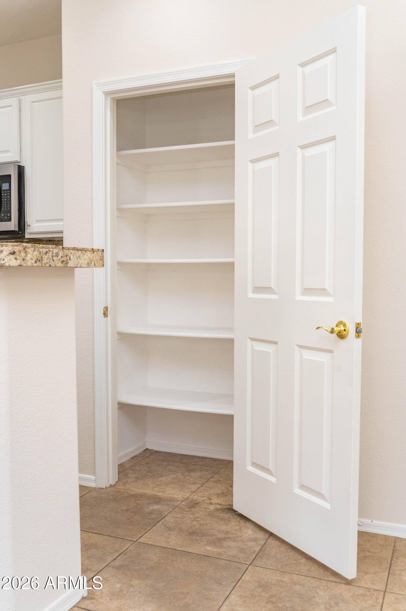 45633 West Mountain View Road Maricopa, AZ 85139 - Photo 31 of 78 a view of an empty room with cabinet and entryway