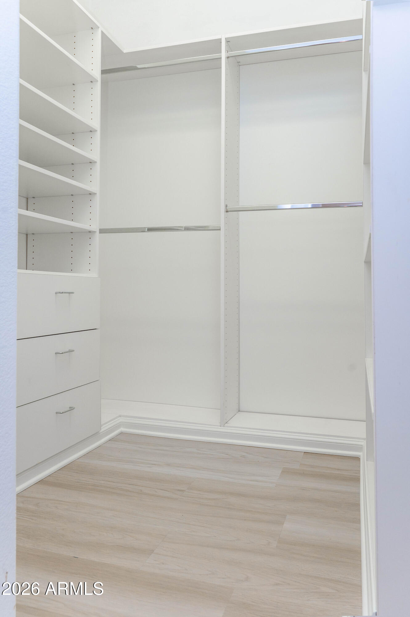 45633 West Mountain View Road Maricopa, AZ 85139 - Photo 36 of 78 a view of an empty walk in closet