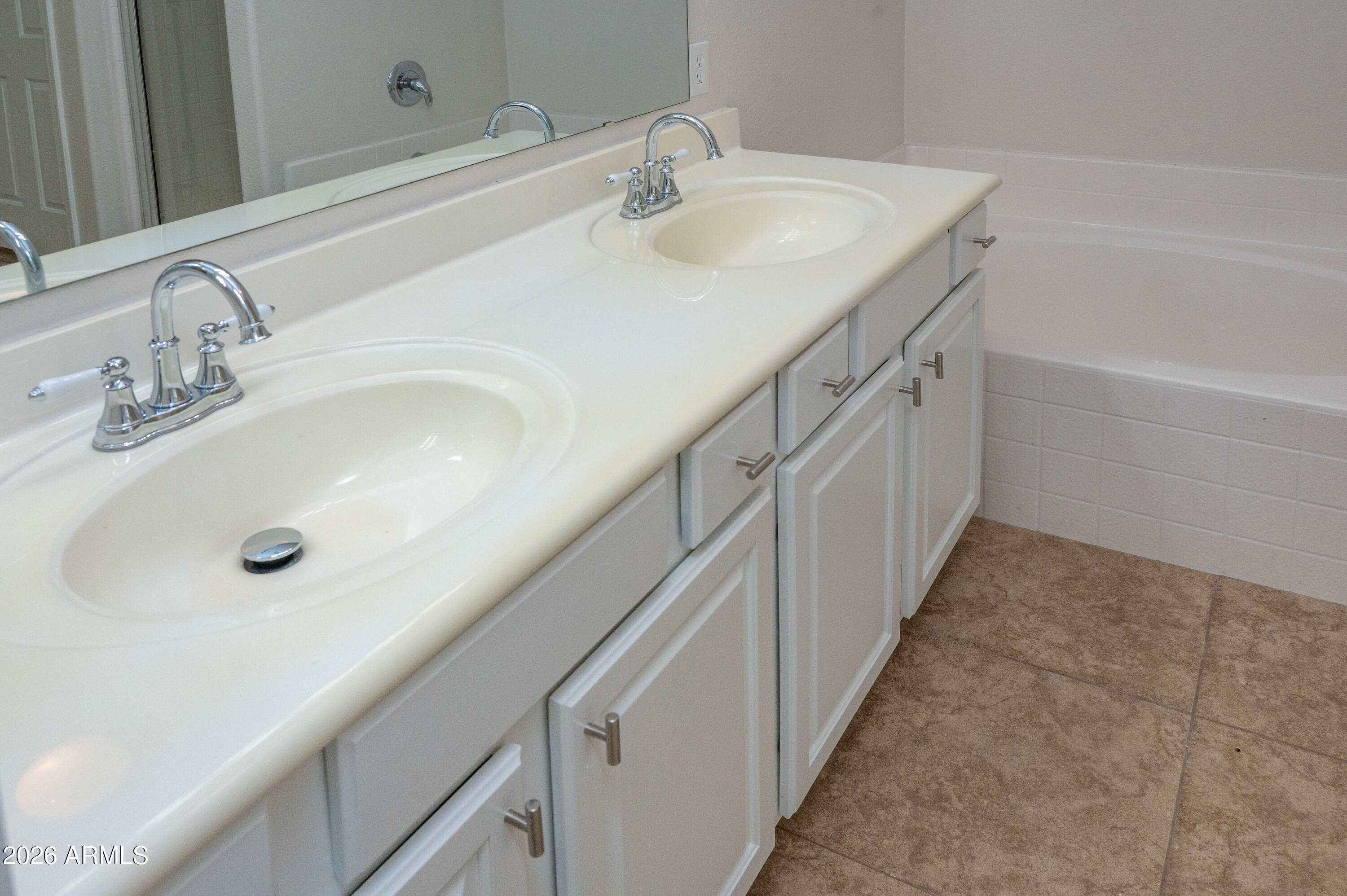 45633 West Mountain View Road Maricopa, AZ 85139 - Photo 41 of 78 a bathroom with a sink and a tub
