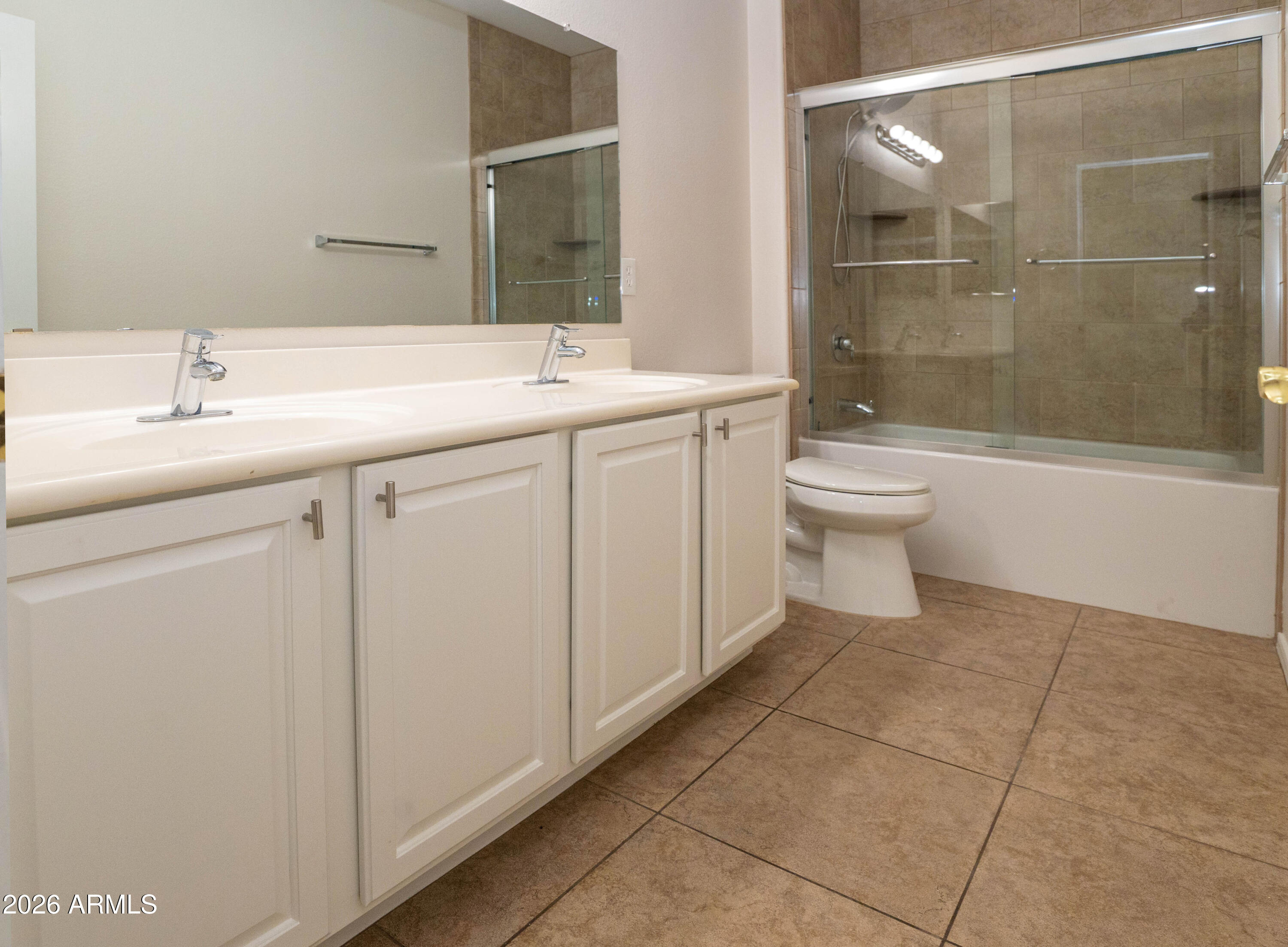 45633 West Mountain View Road Maricopa, AZ 85139 - Photo 49 of 78 a bathroom with a sink toilet and shower