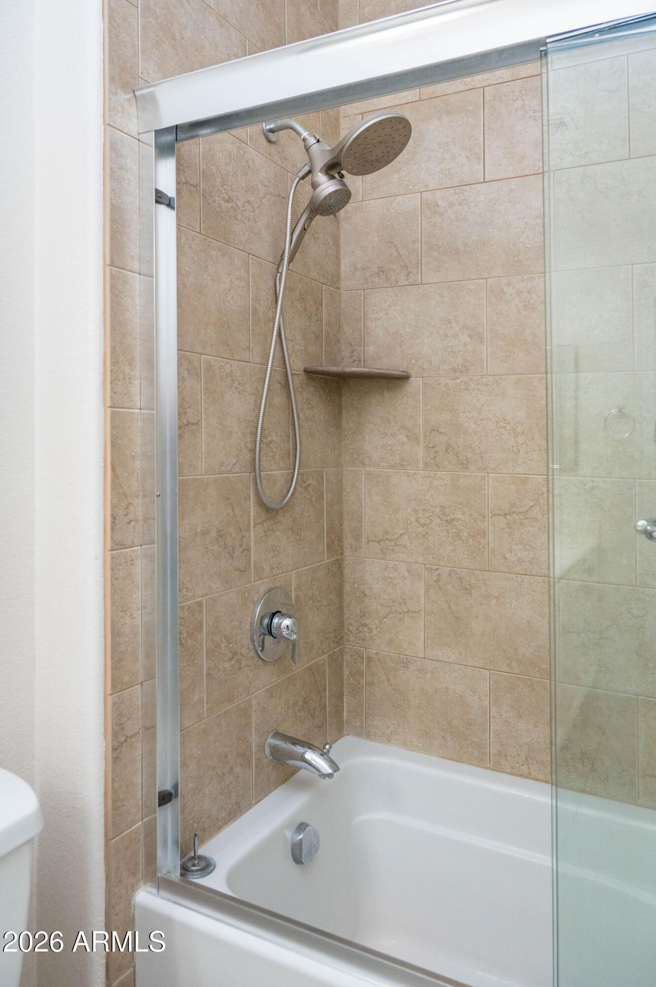 45633 West Mountain View Road Maricopa, AZ 85139 - Photo 51 of 78 a bathroom with a shower and a toilet