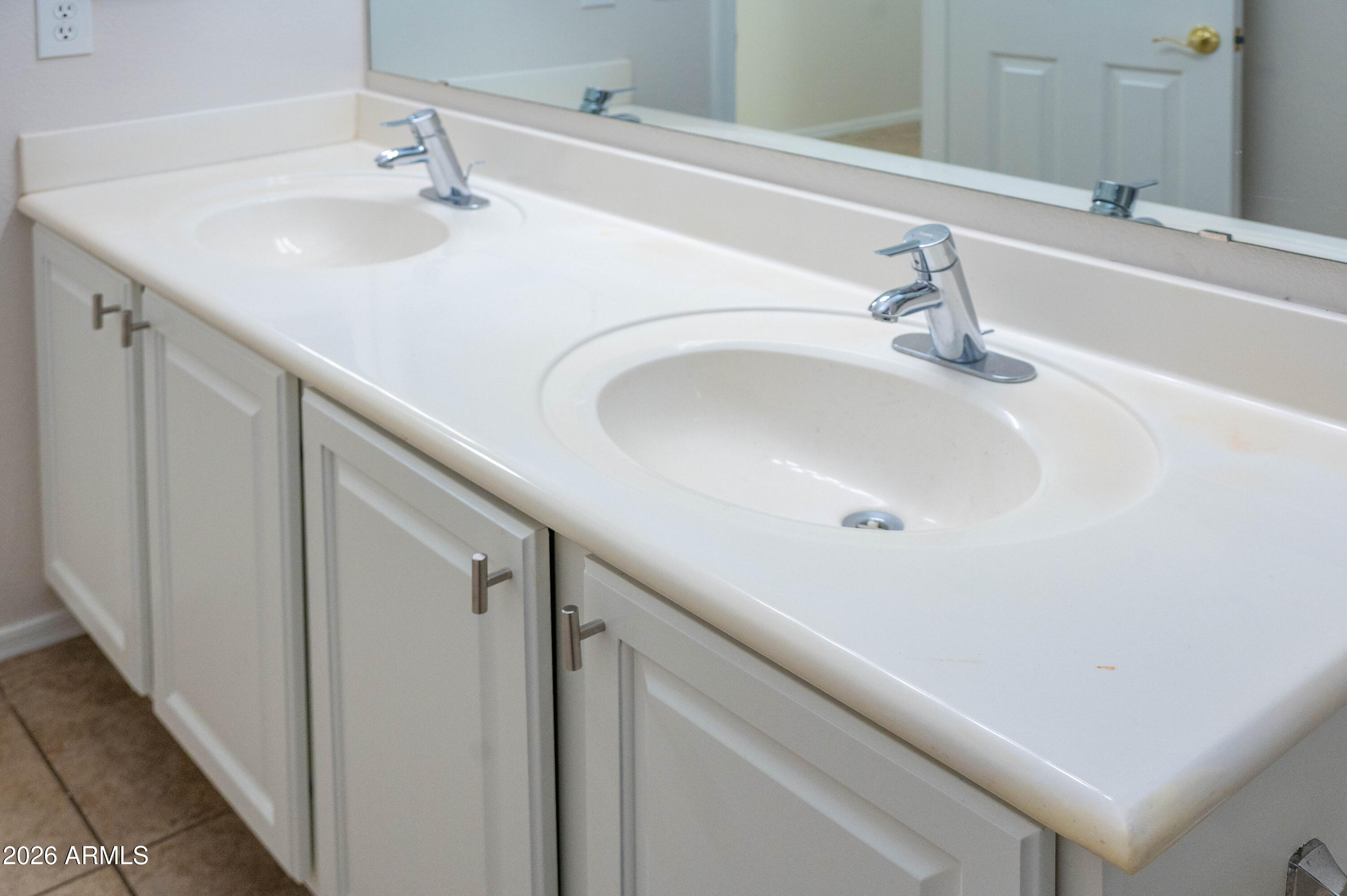 45633 West Mountain View Road Maricopa, AZ 85139 - Photo 53 of 78 a bathroom with a sink and a mirror