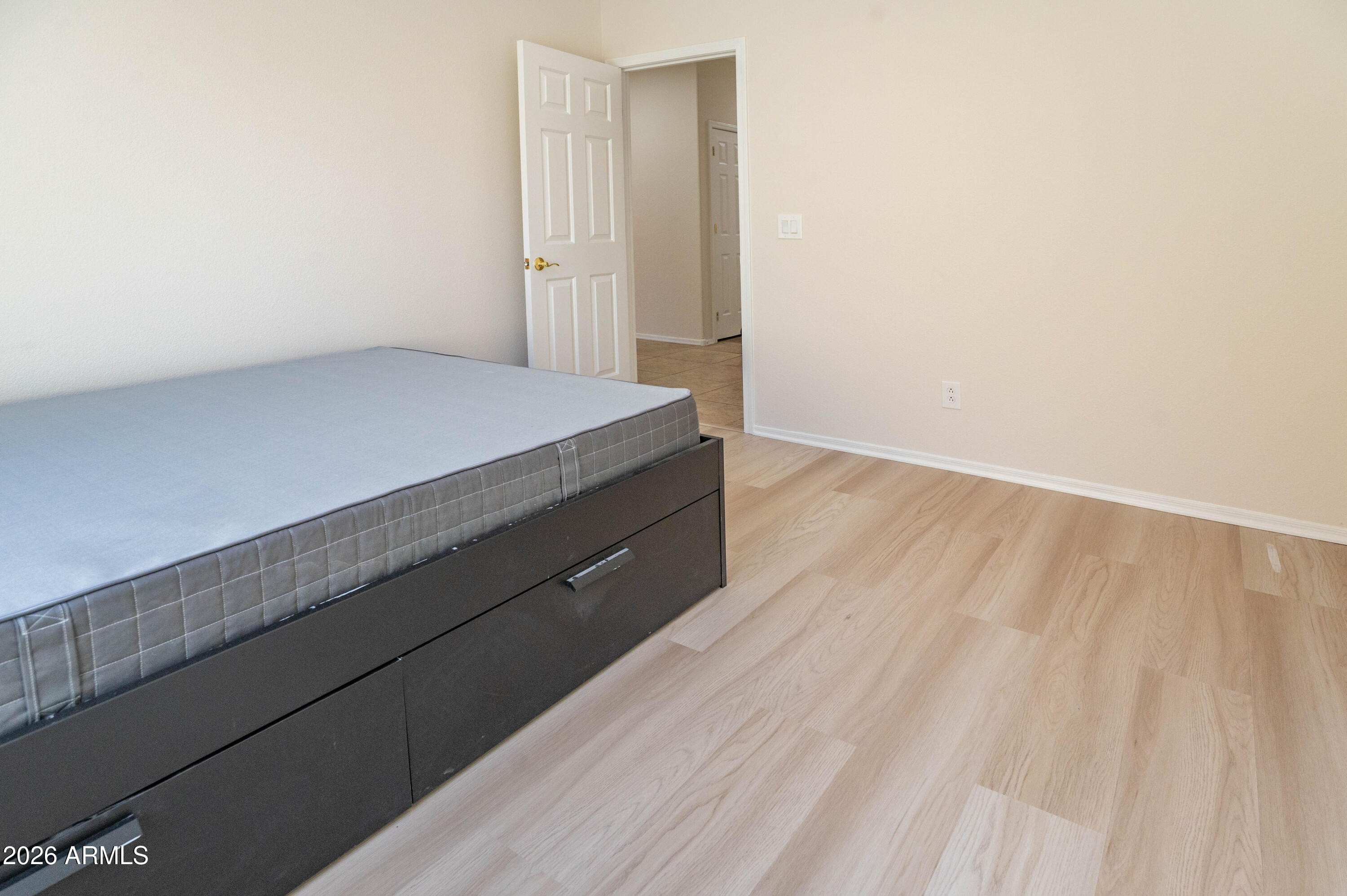 45633 West Mountain View Road Maricopa, AZ 85139 - Photo 55 of 78 a view of room and wooden floor