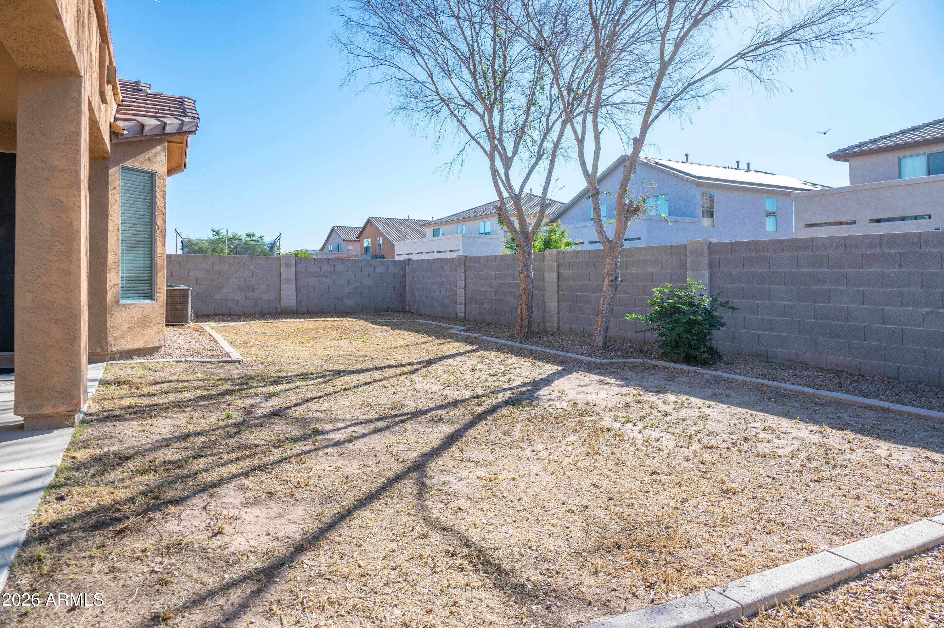 45633 West Mountain View Road Maricopa, AZ 85139 - Photo 57 of 78 a view of a backyard