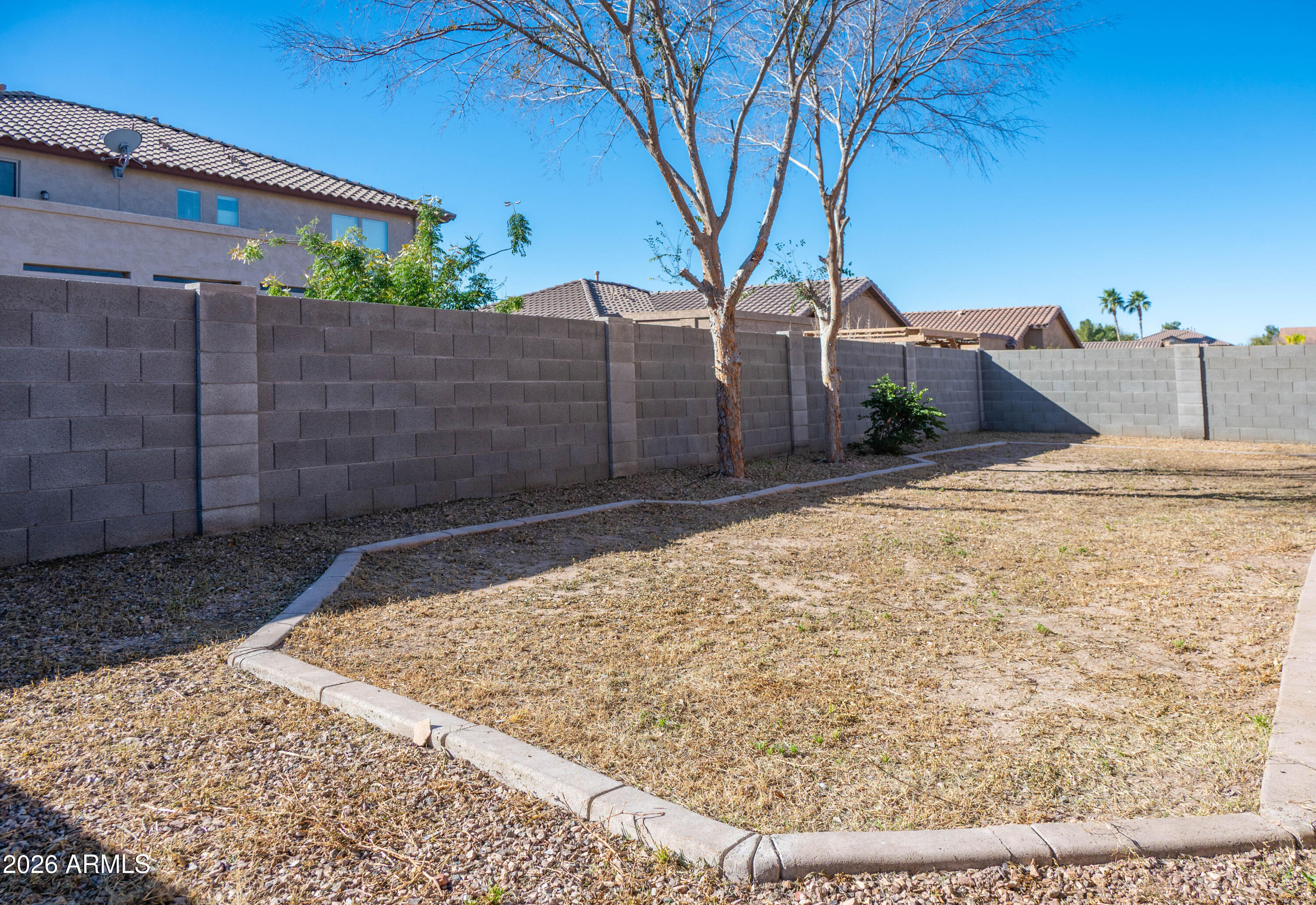 45633 West Mountain View Road Maricopa, AZ 85139 - Photo 58 of 78 a view of a backyard of the house